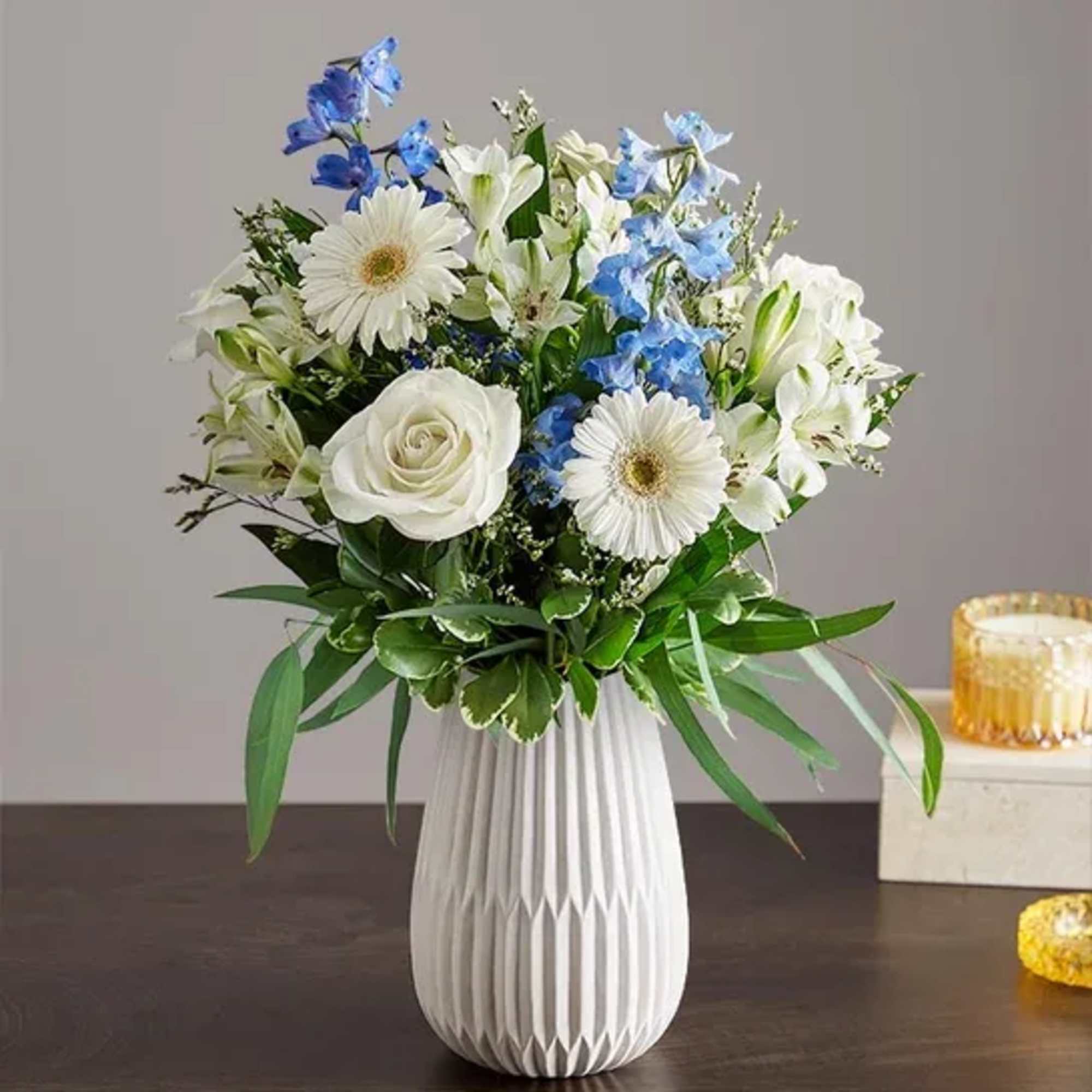 Hand designed by our florists, this elegant gathering features soothing blue and