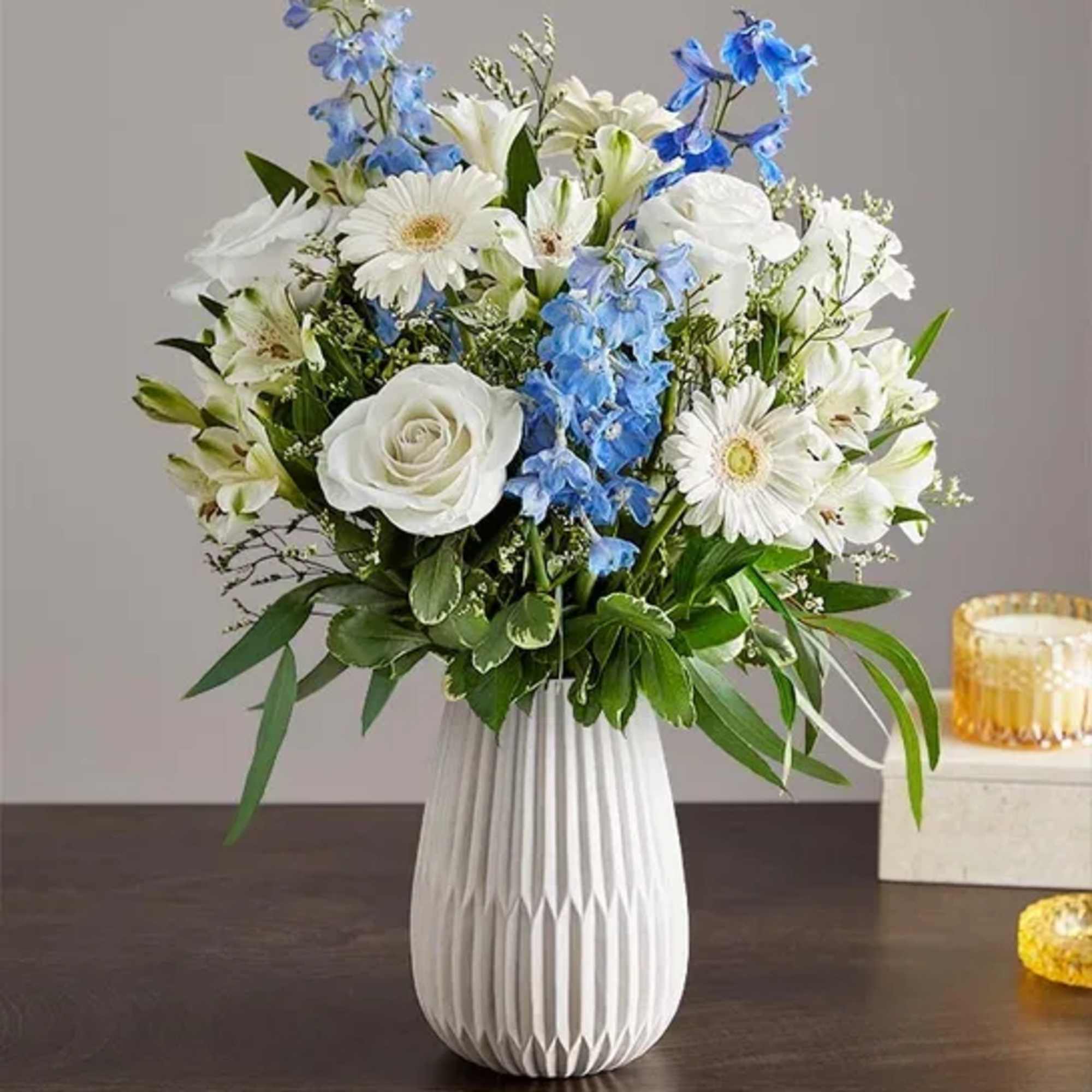 Hand designed by our florists, this elegant gathering features soothing blue and