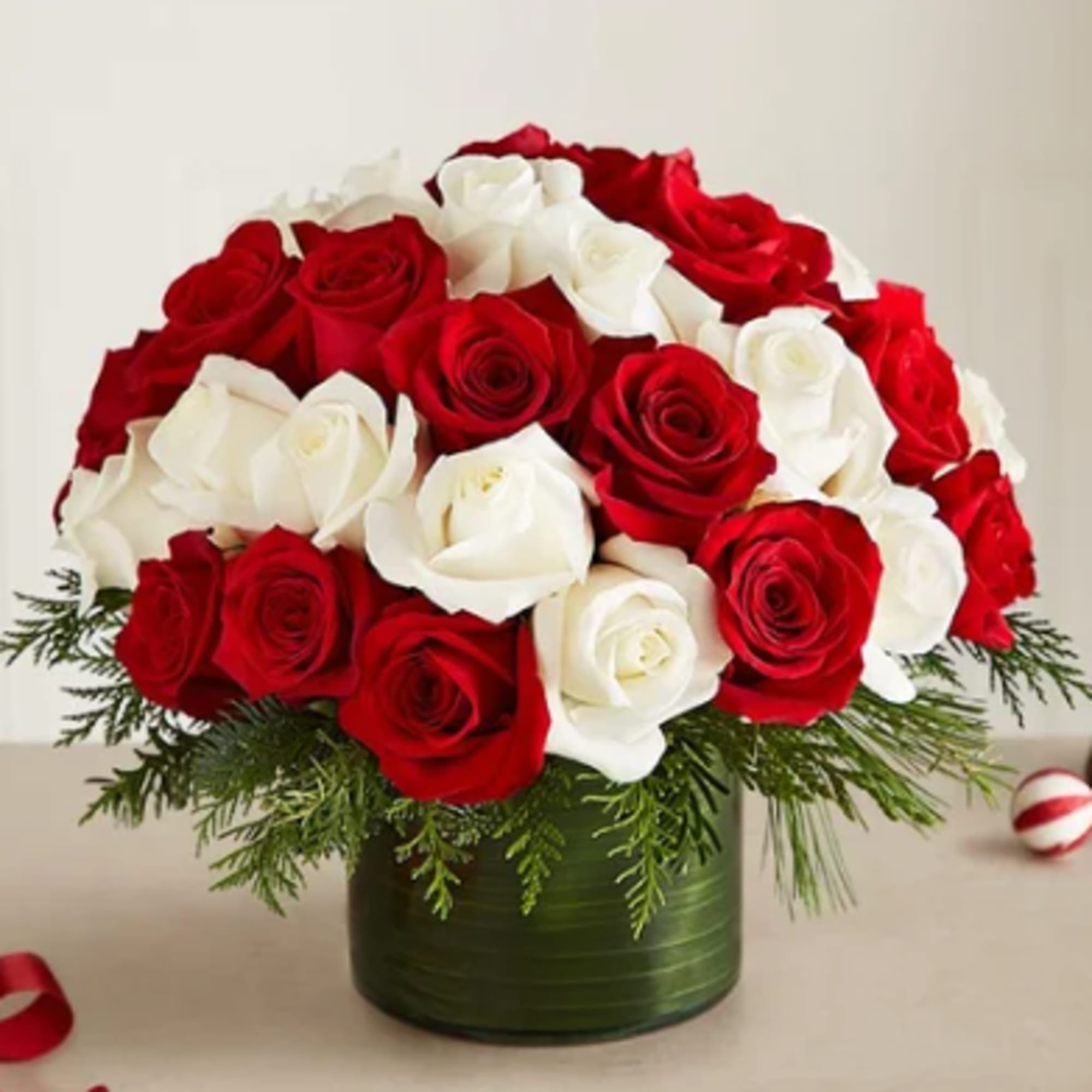 Classic Christmas with a fun, modern twist! Our red and white roses