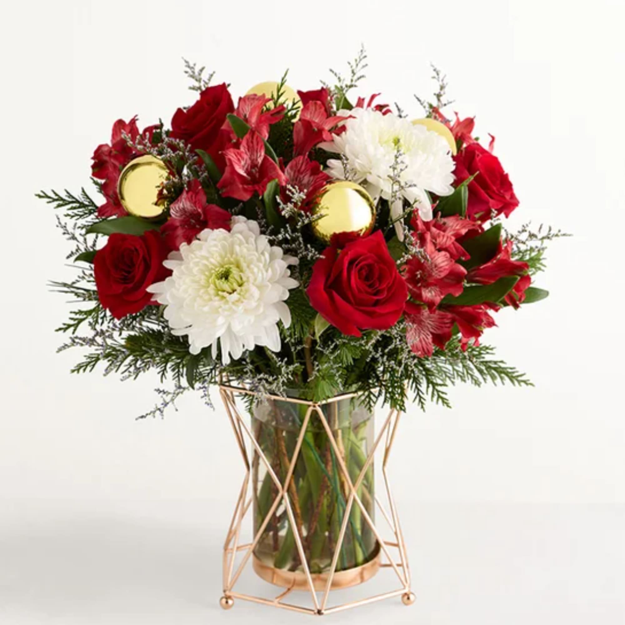 Red roses and white chrysanthemums in a glass vase with gold accents