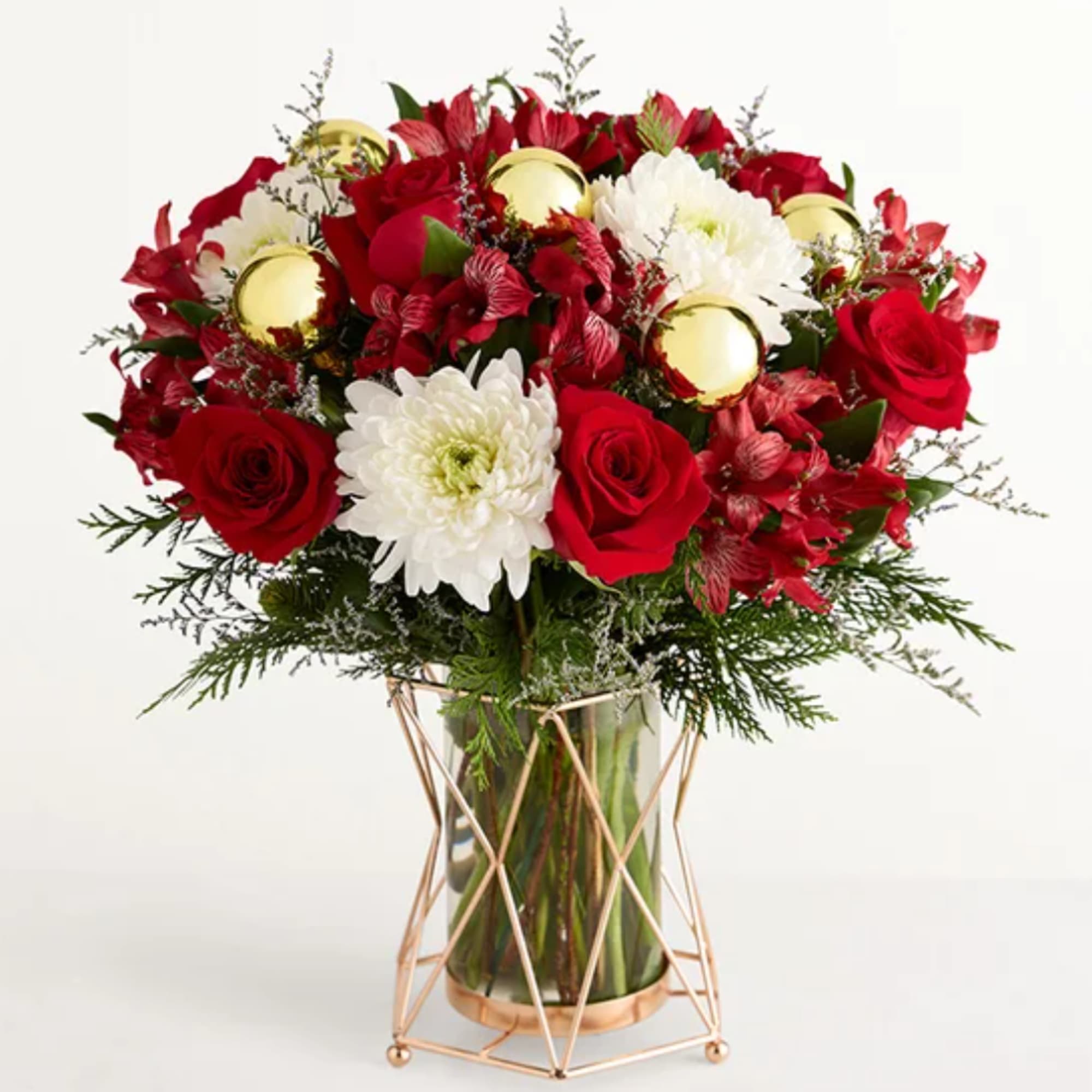 Red roses and white chrysanthemums in a glass vase with gold ornaments