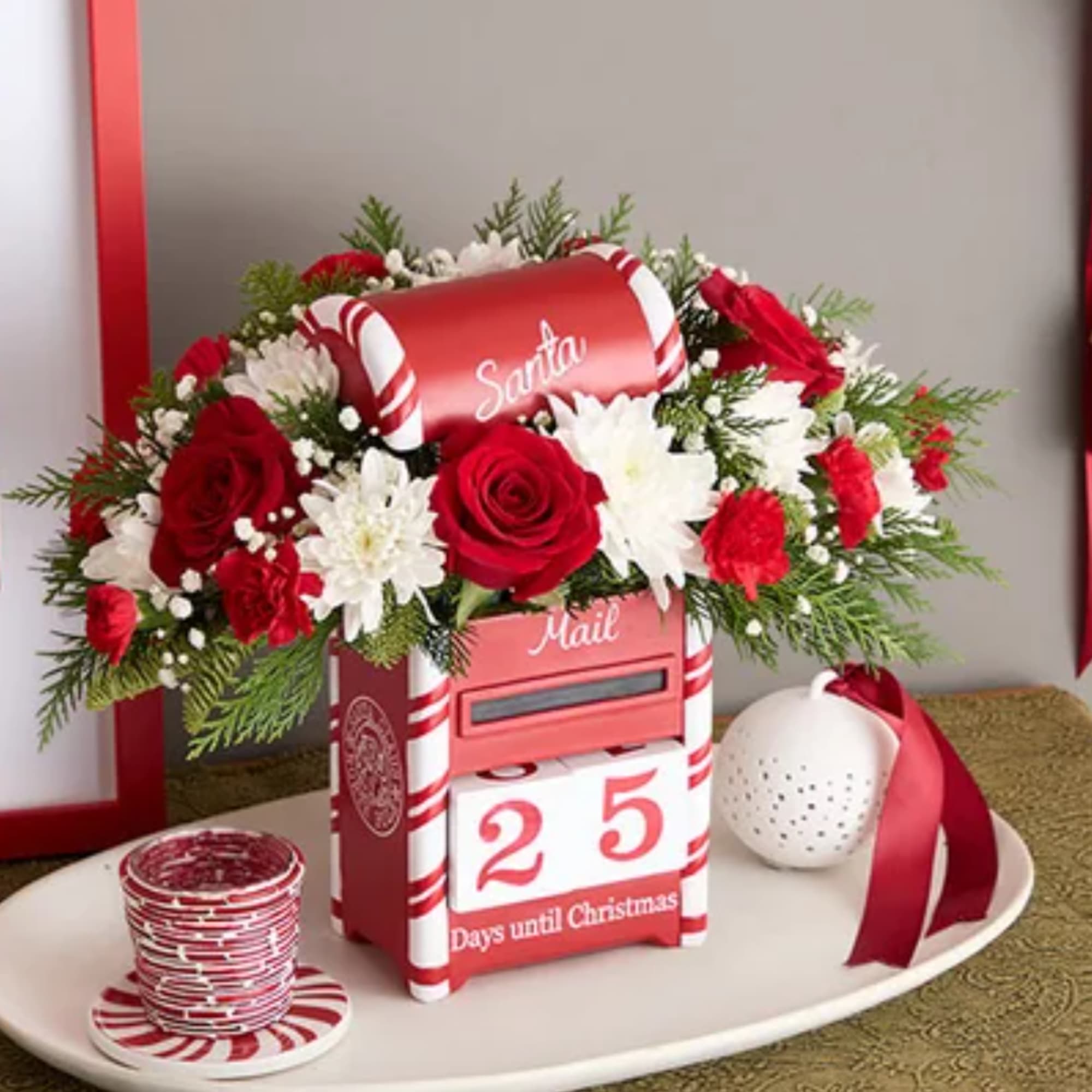 Christmas mailbox arrangement with red roses and white daisies