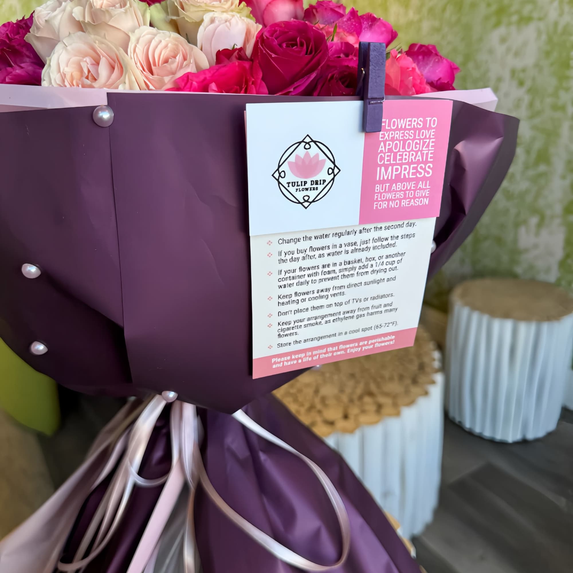 Bouquet of pink and cream roses wrapped in purple paper, photo 3 of 3