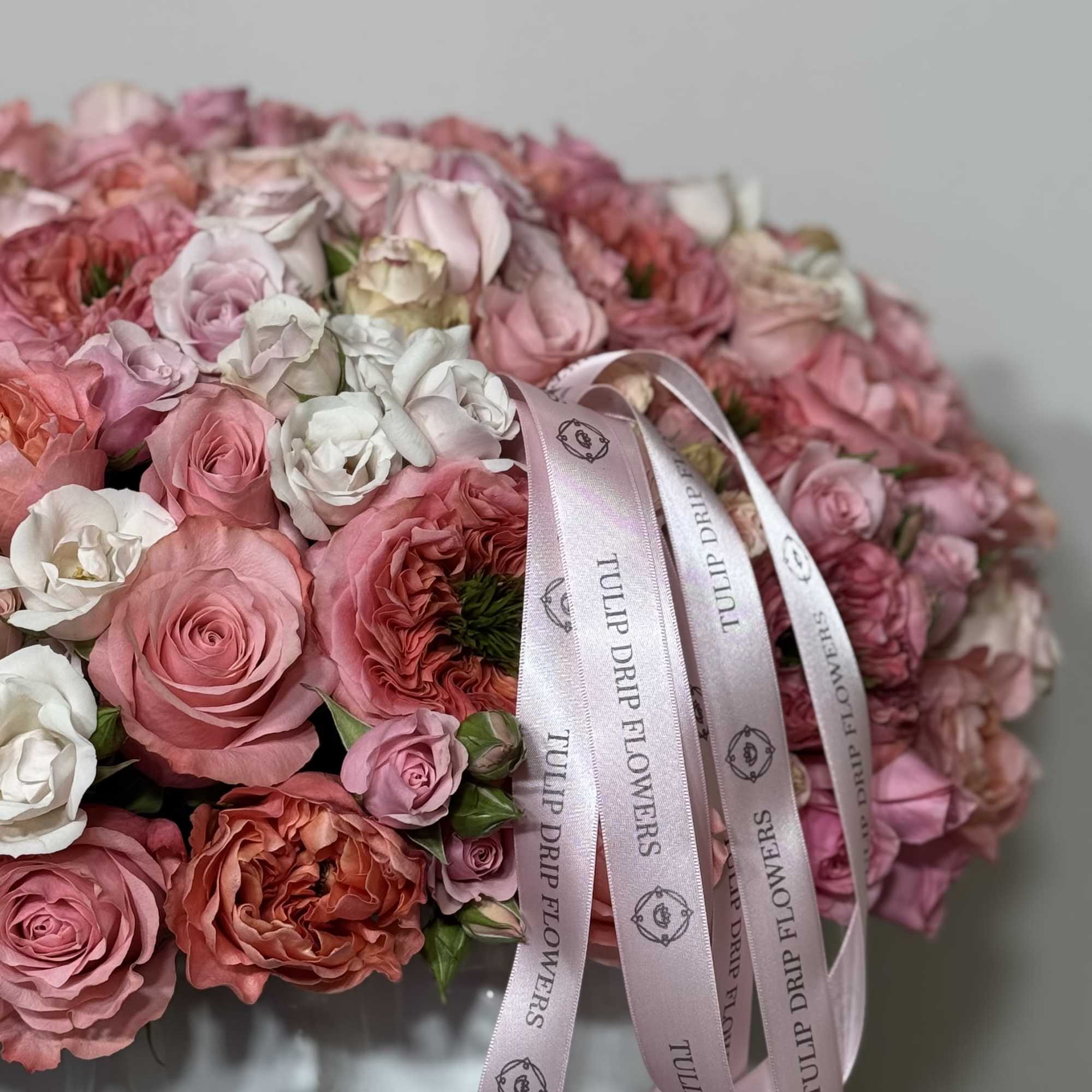 Large pink and white rose bouquet with satin ribbons
