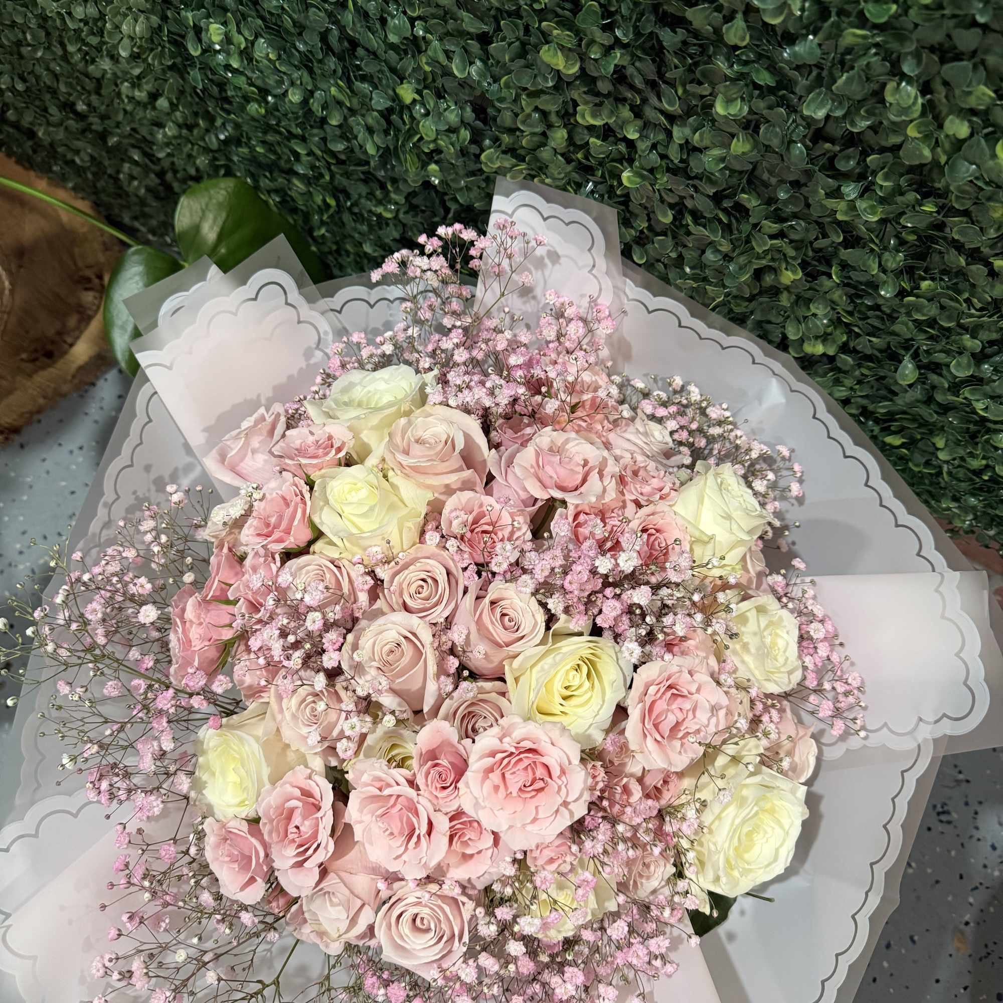 Bouquet of pale pink and cream roses with baby's breath