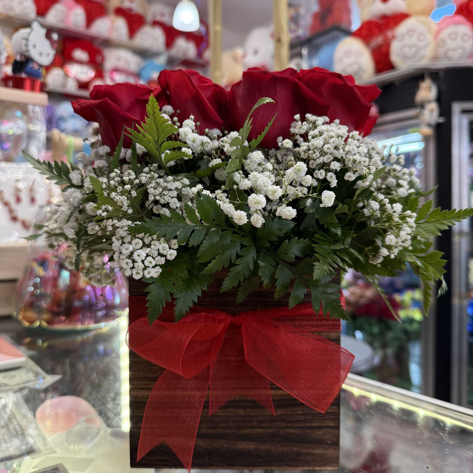 This eye-catching arrangement offers a modern twist on the classic dozen. Rustic