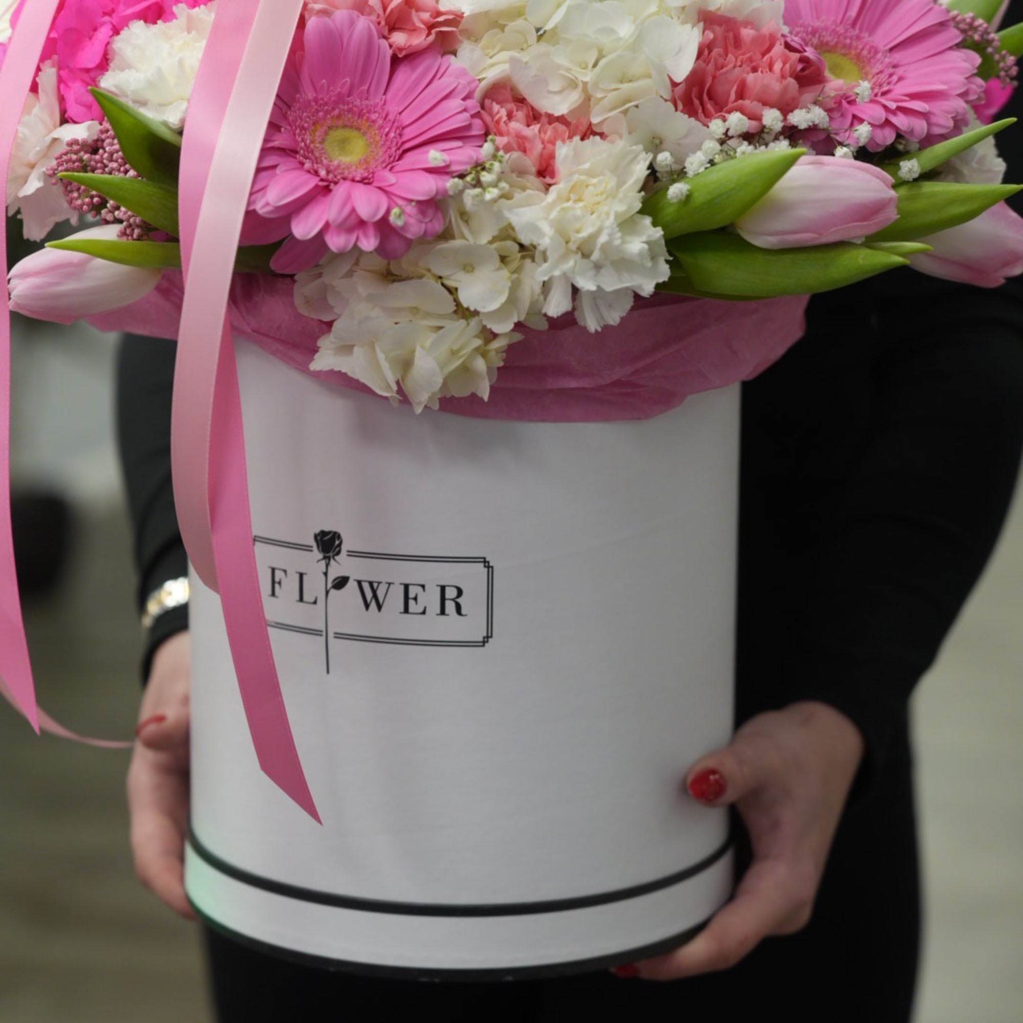 Pink and white bouquet in a round white box with ribbon
