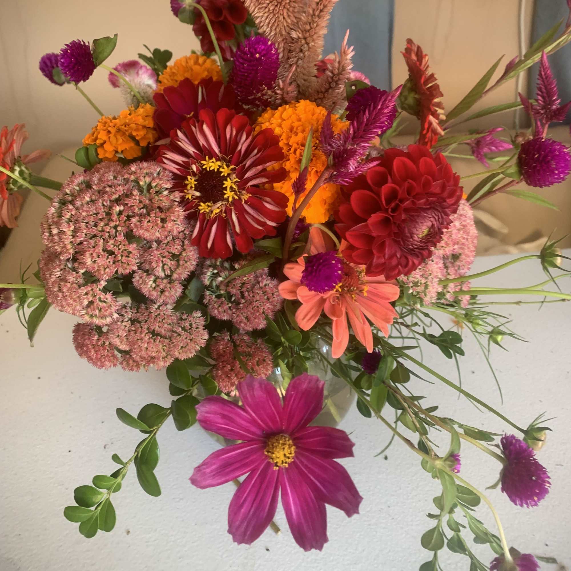 Mixed bouquet with red, pink, orange, and purple flowers