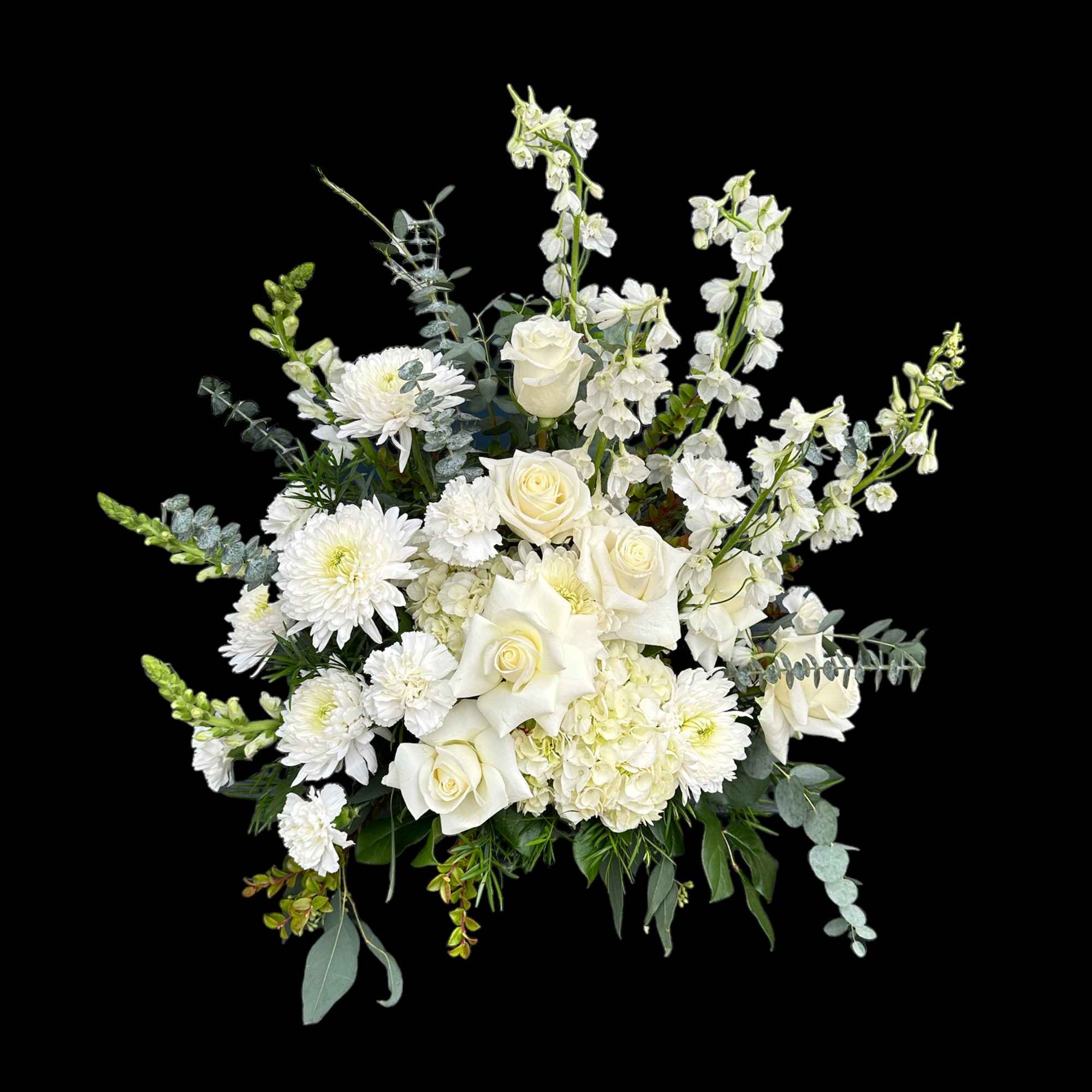 White roses and chrysanthemums arranged with tall white blooms