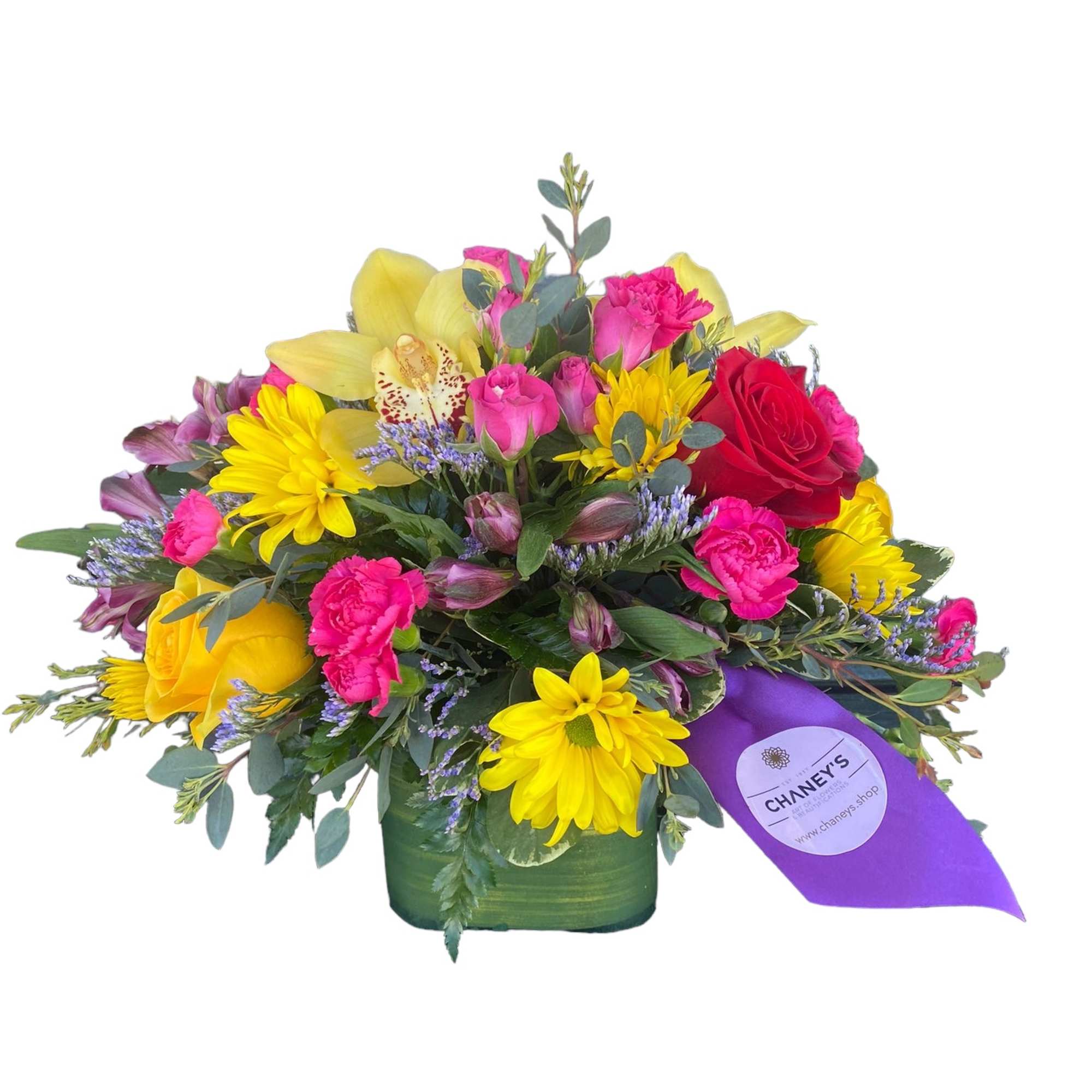 Mixed bouquet of roses, daisies, and orchids in a green vase
