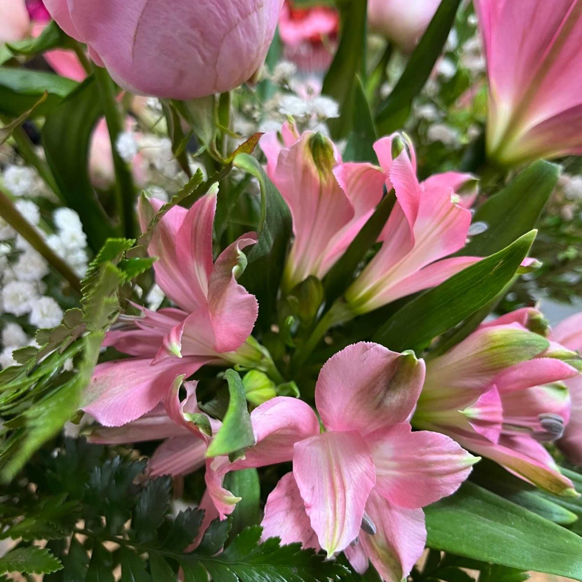 Pink lilies and alstroemeria in a mixed bouquet