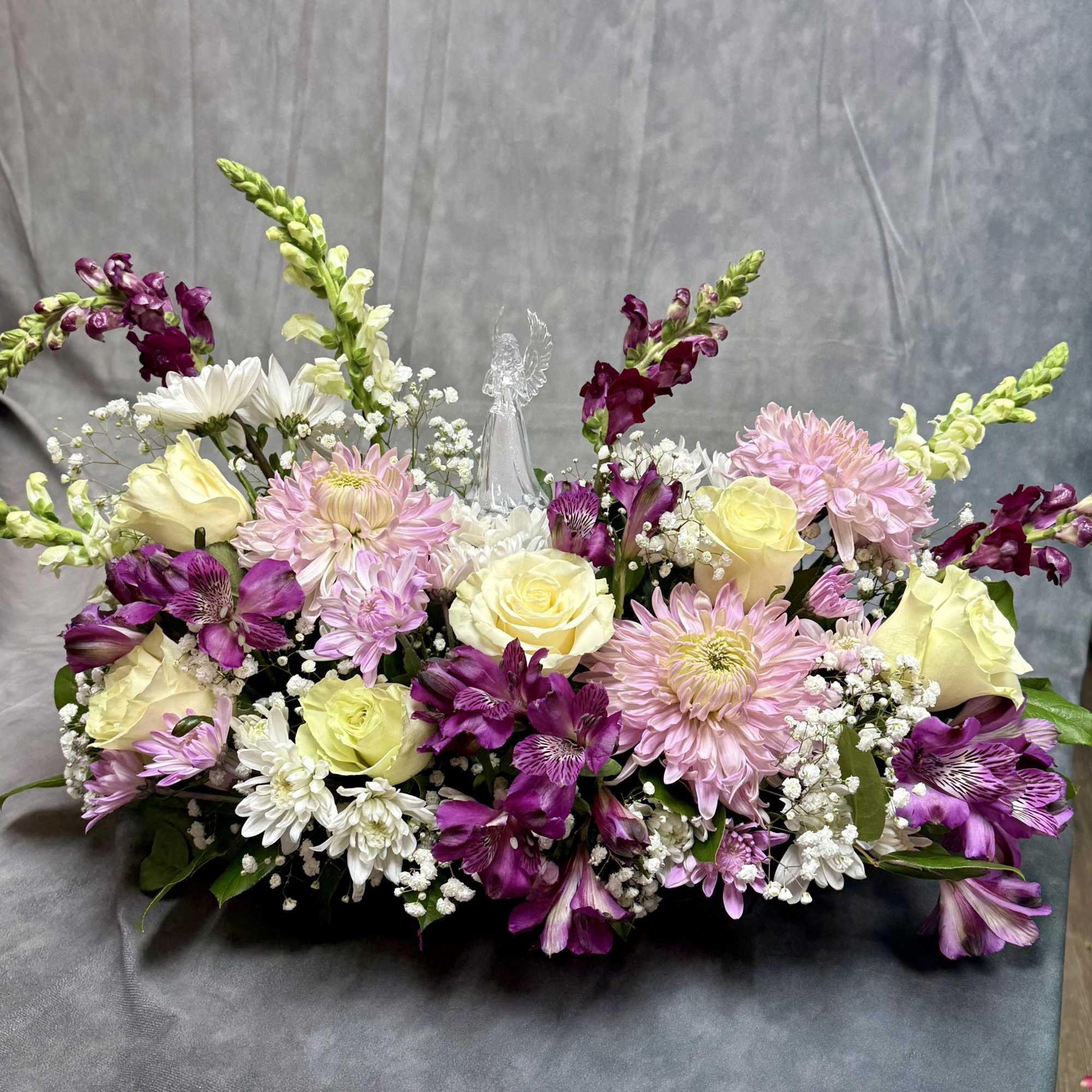 Mixed bouquet with pink, white, yellow, and purple flowers