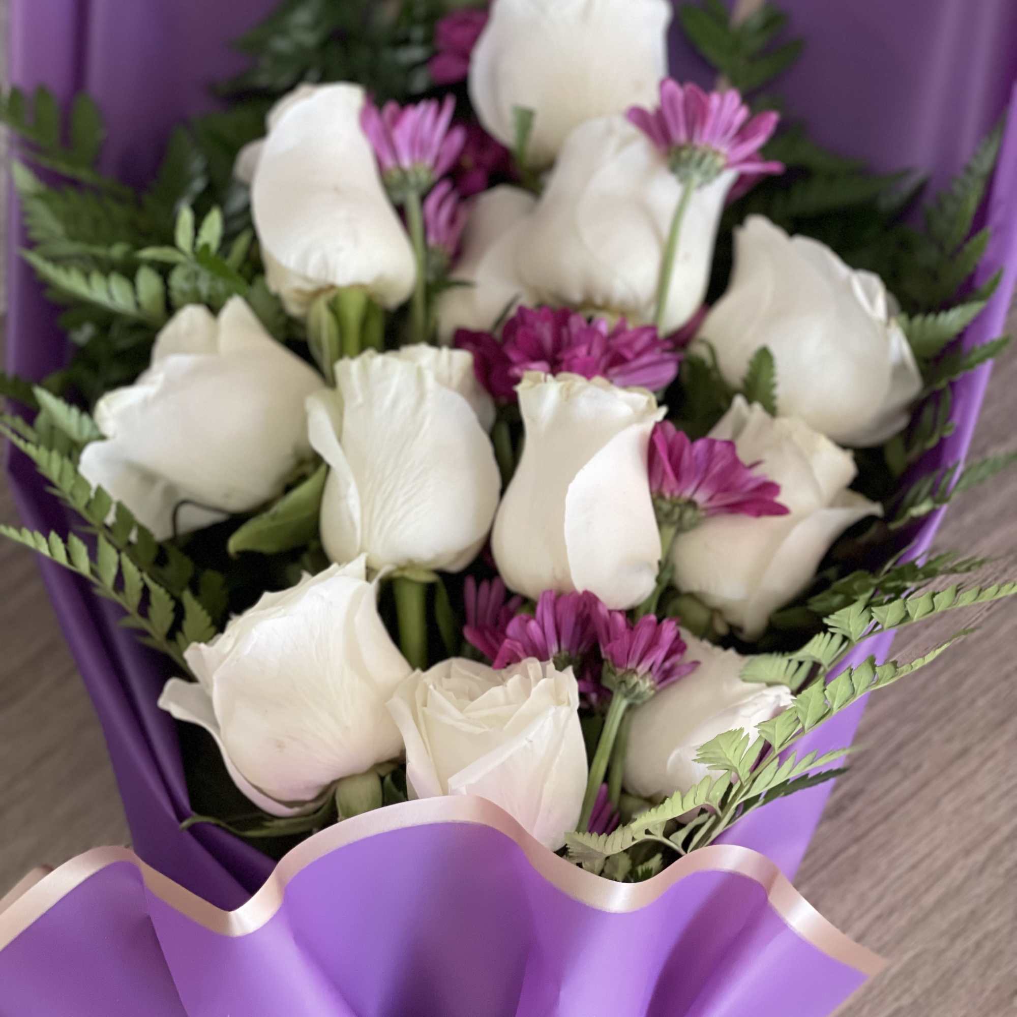 Bouquet of white roses and purple daisies wrapped in purple paper, photo 2 of 2