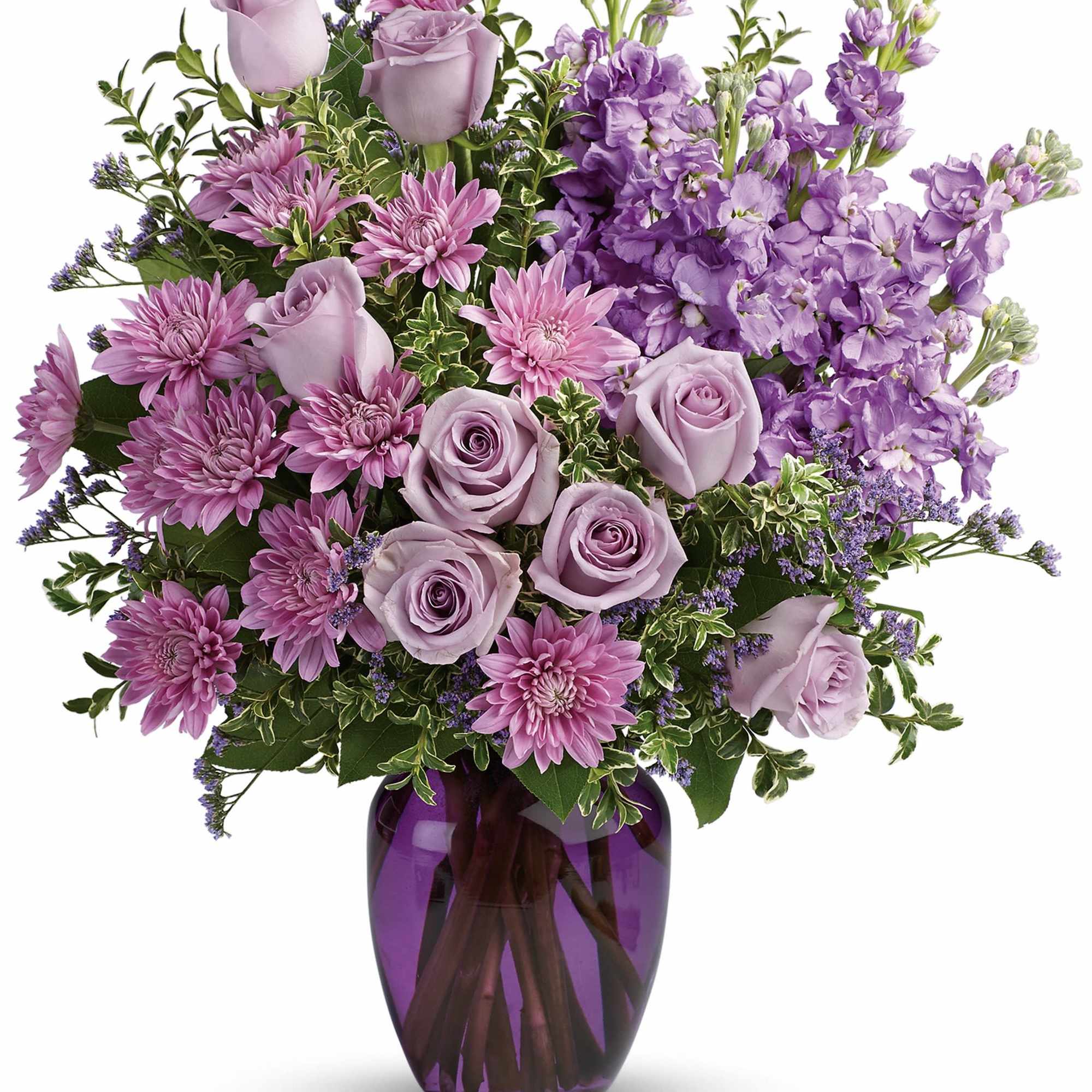 Lavender roses and purple flowers arranged in a purple glass vase