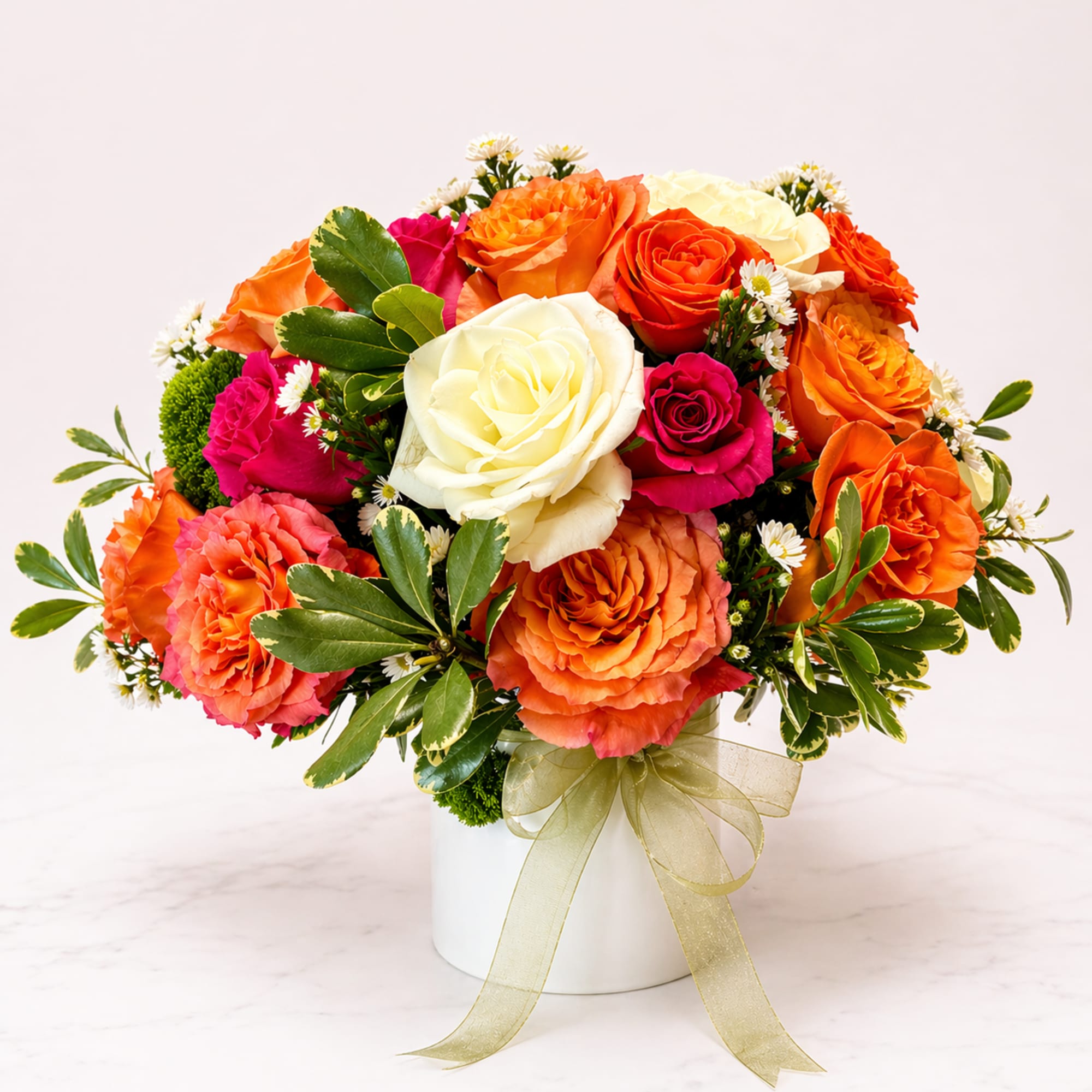 A bold and beautiful blend of ivory, fuchsia, and vibrant orange blooms