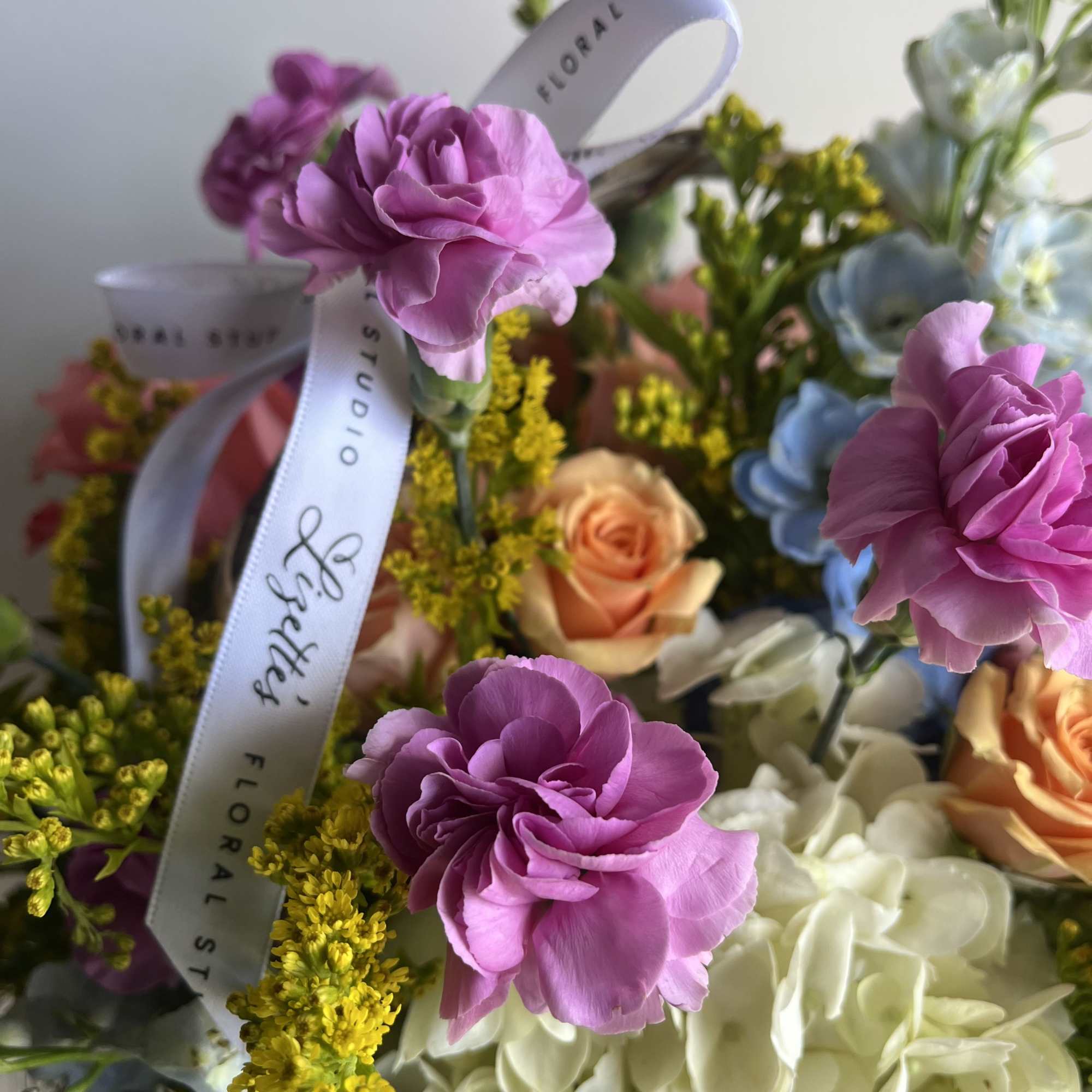Elevate the classic basket arrangement with a custom-designed display of fresh, seasonal, photo 2 of 2