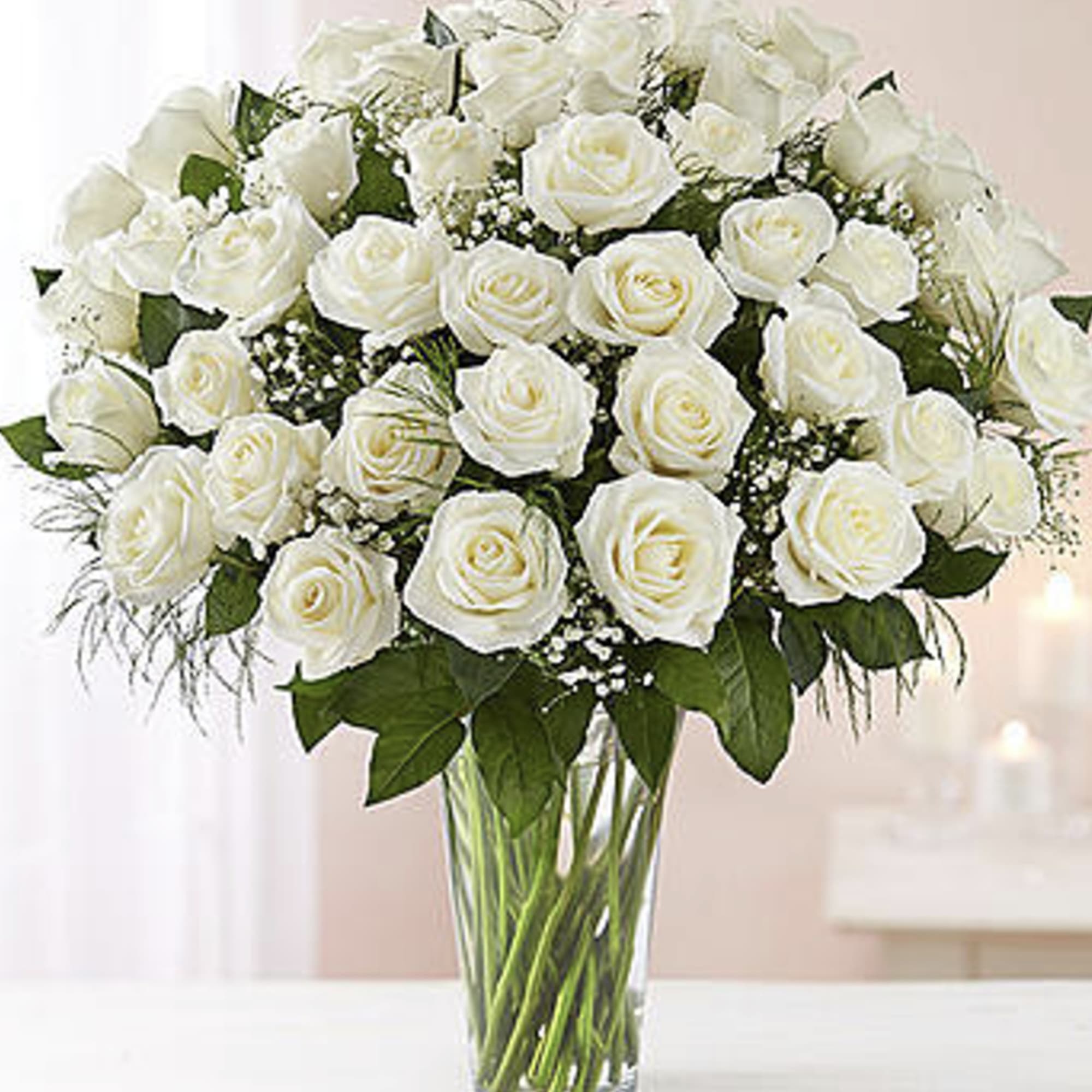 A dozen white roses are a classic gift! Perfect for any expression