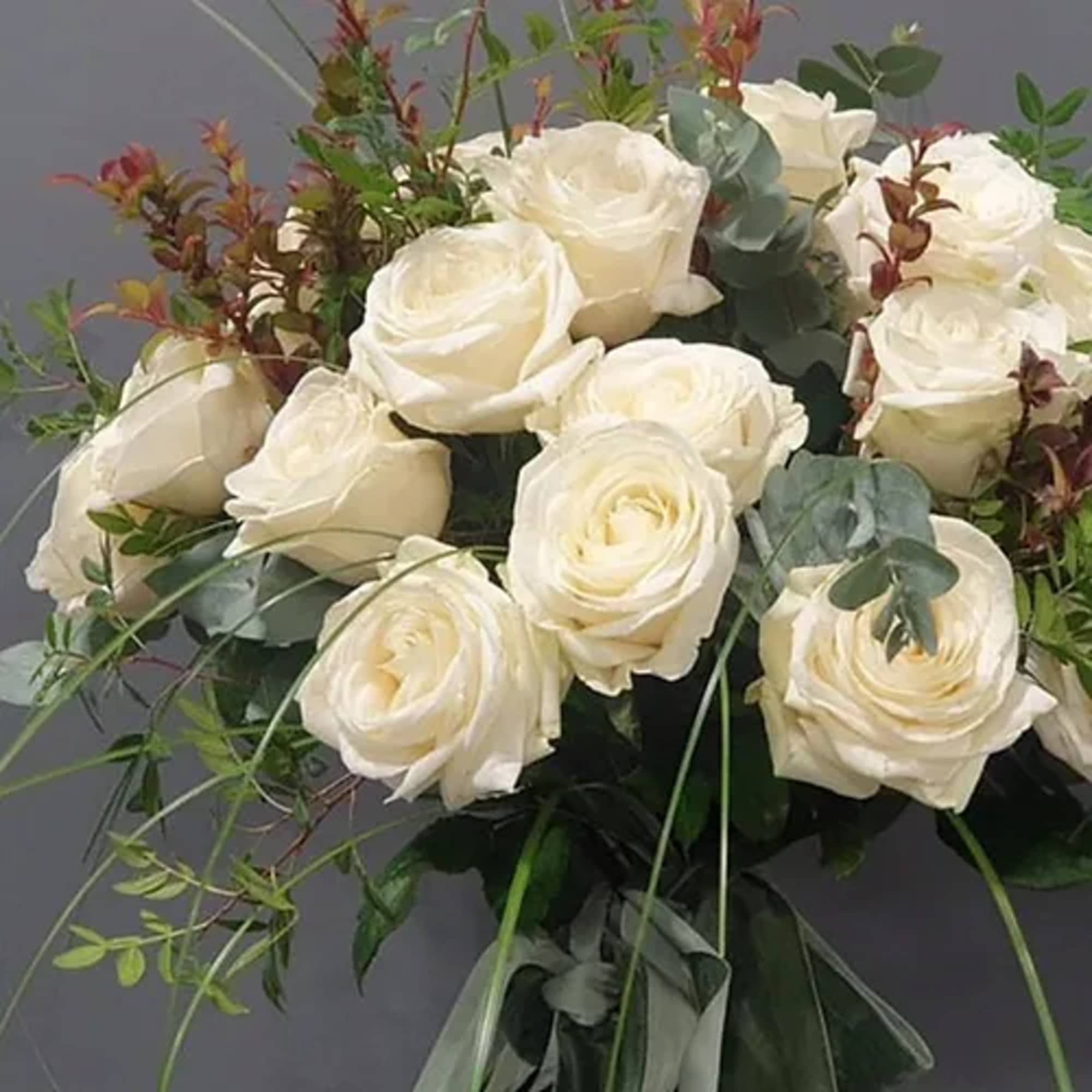 Bouquet of white roses with eucalyptus and greenery