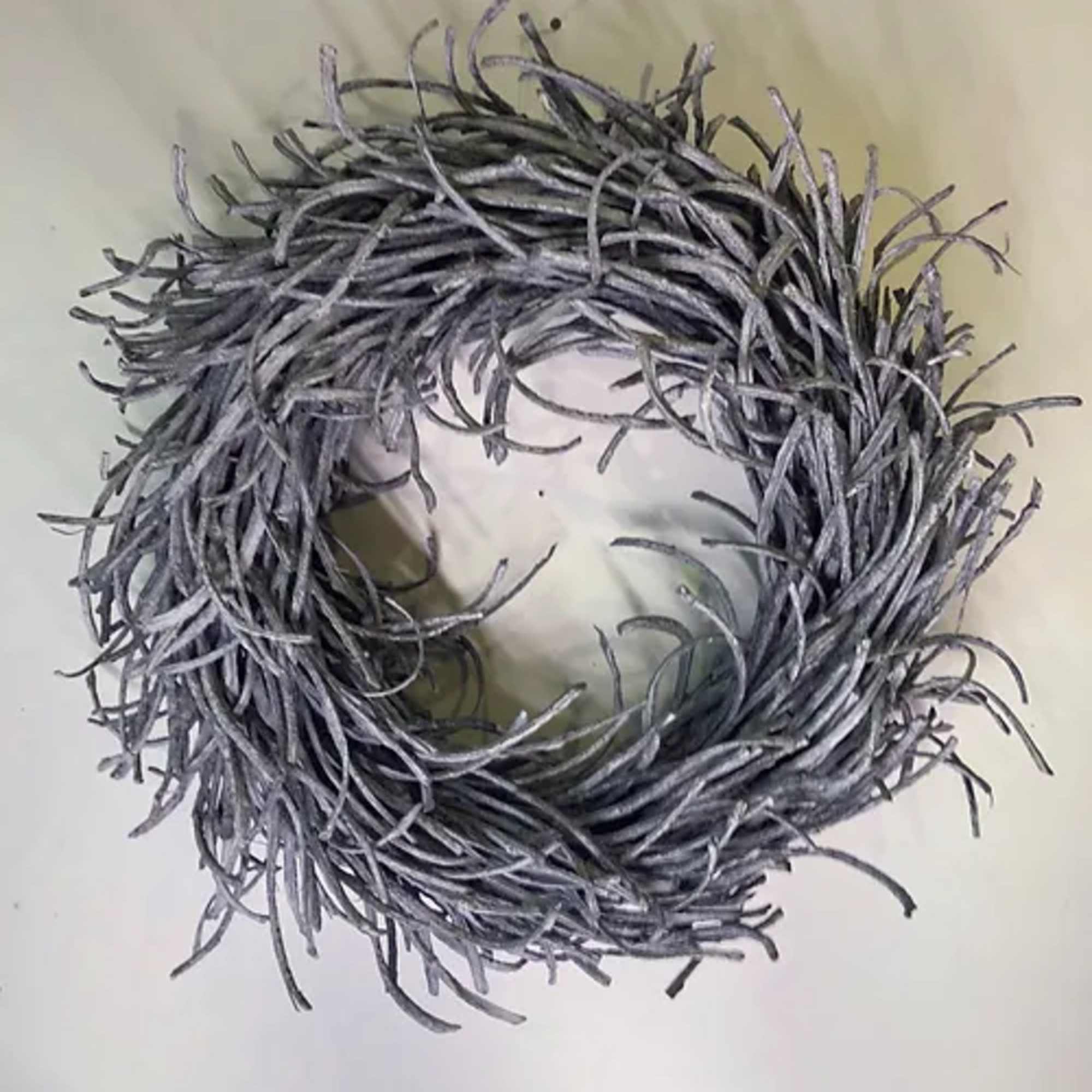 Gray twig wreath with a circular opening