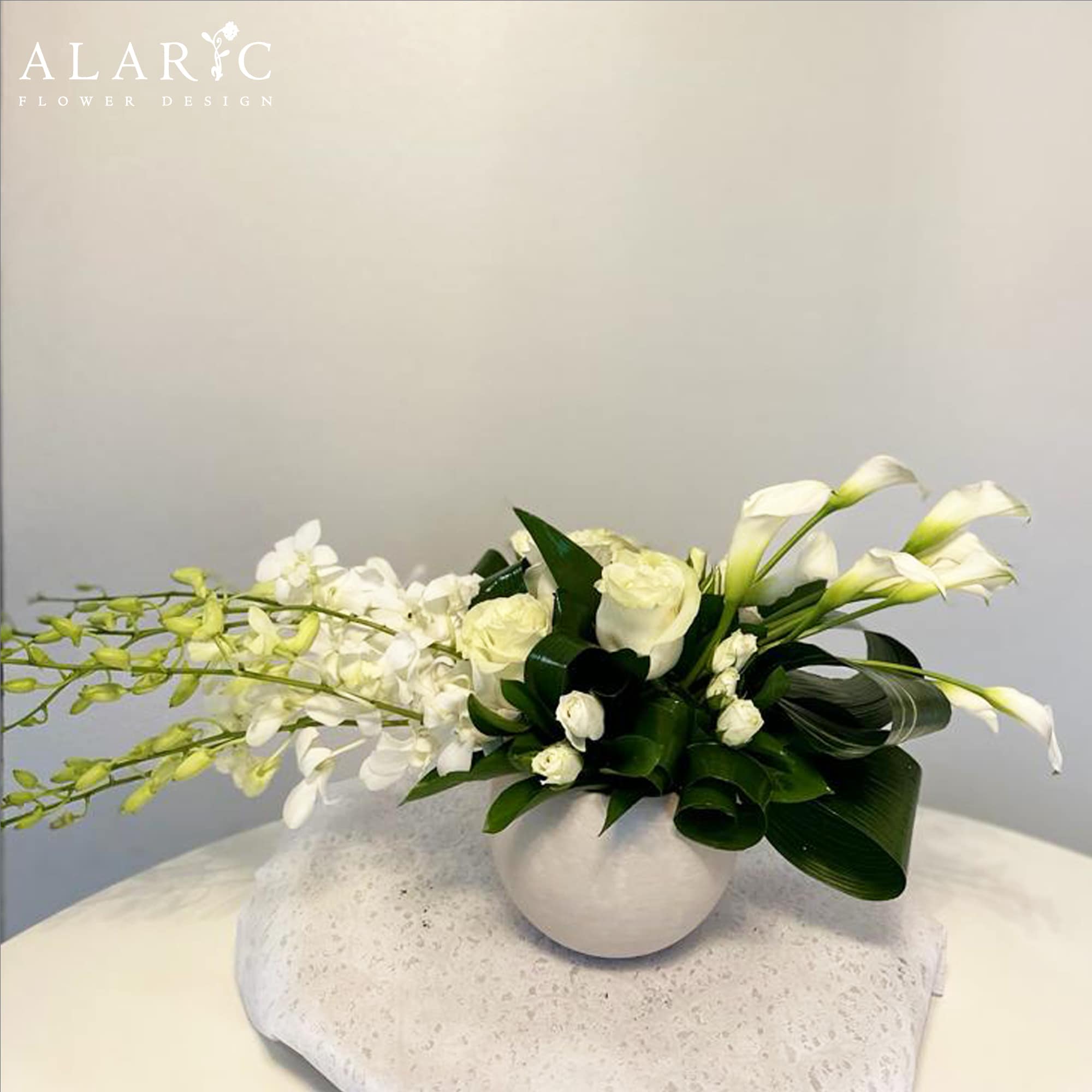 A very classy, simple and elegant arrangement suitable for many occasions:
&bull; Sympathy
&bull;, photo 4 of 4