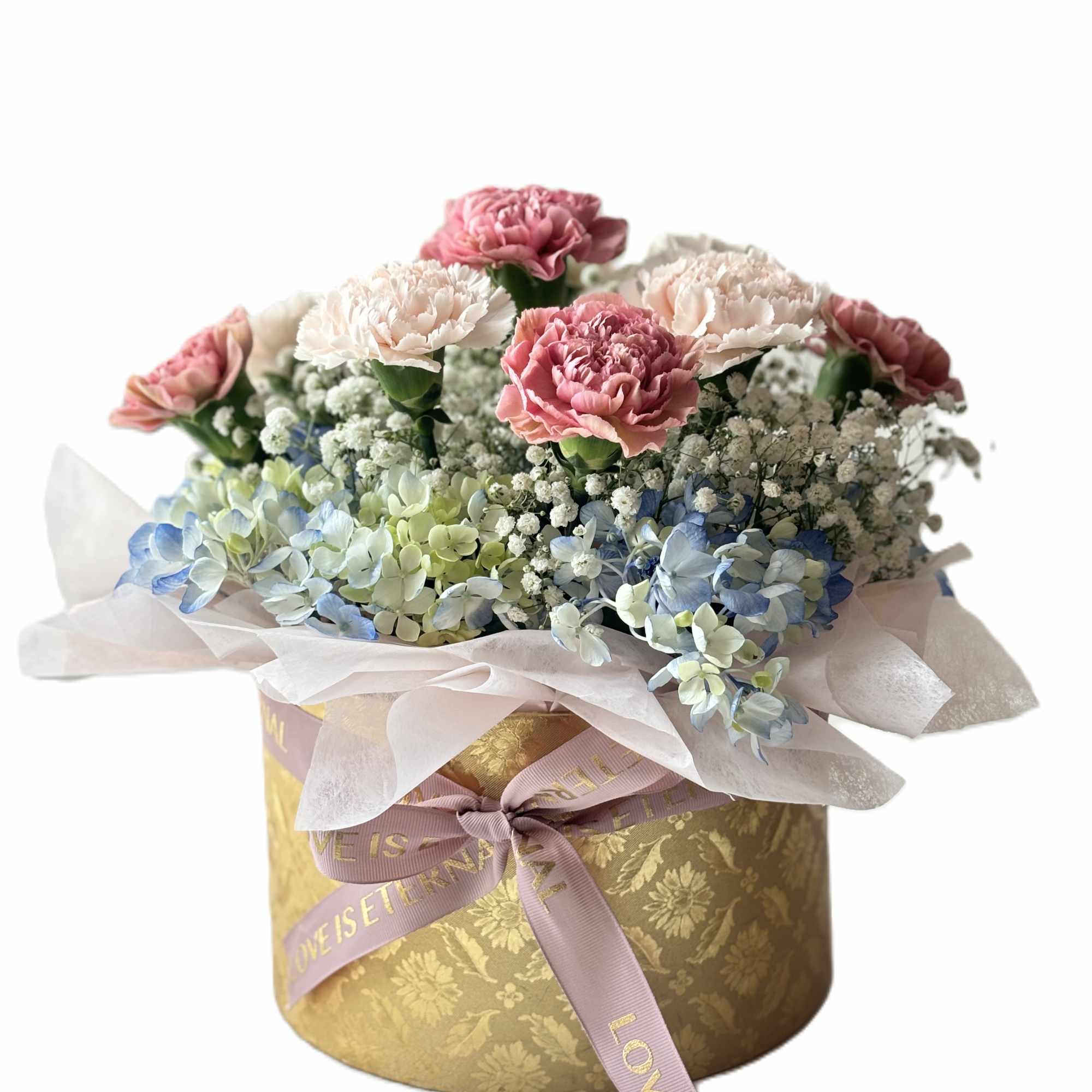 Pink and white carnations with blue hydrangeas in a gold hatbox