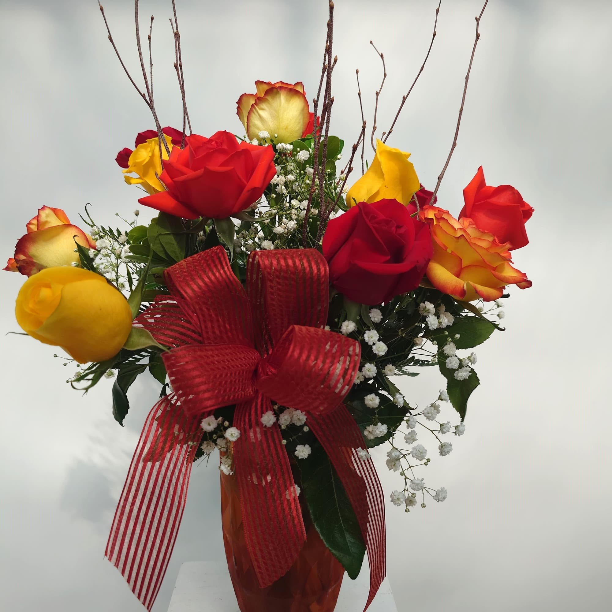 A dozen roses inspired by the Fall season. We do same day