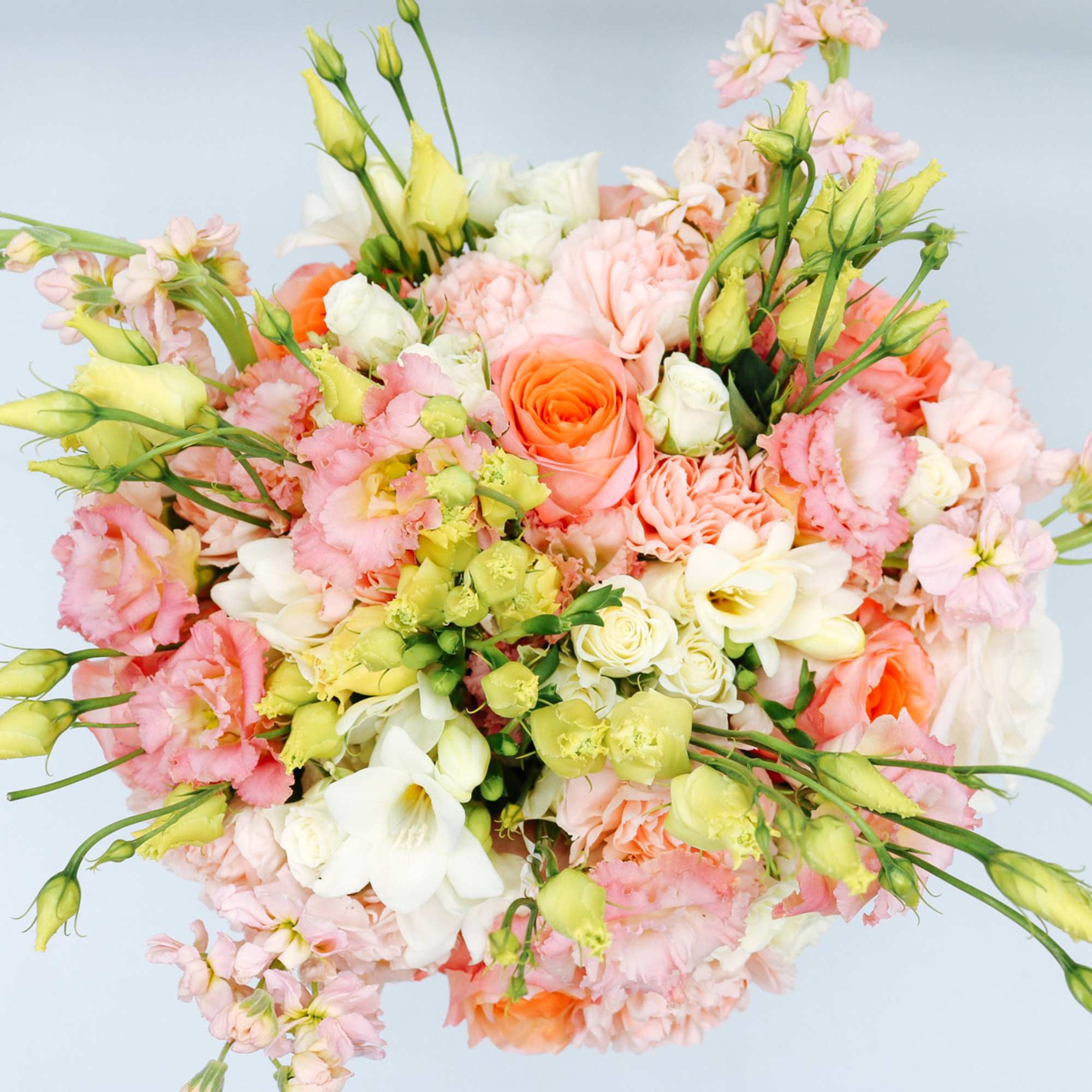 Bouquet of peach, pink, white, and yellow flowers