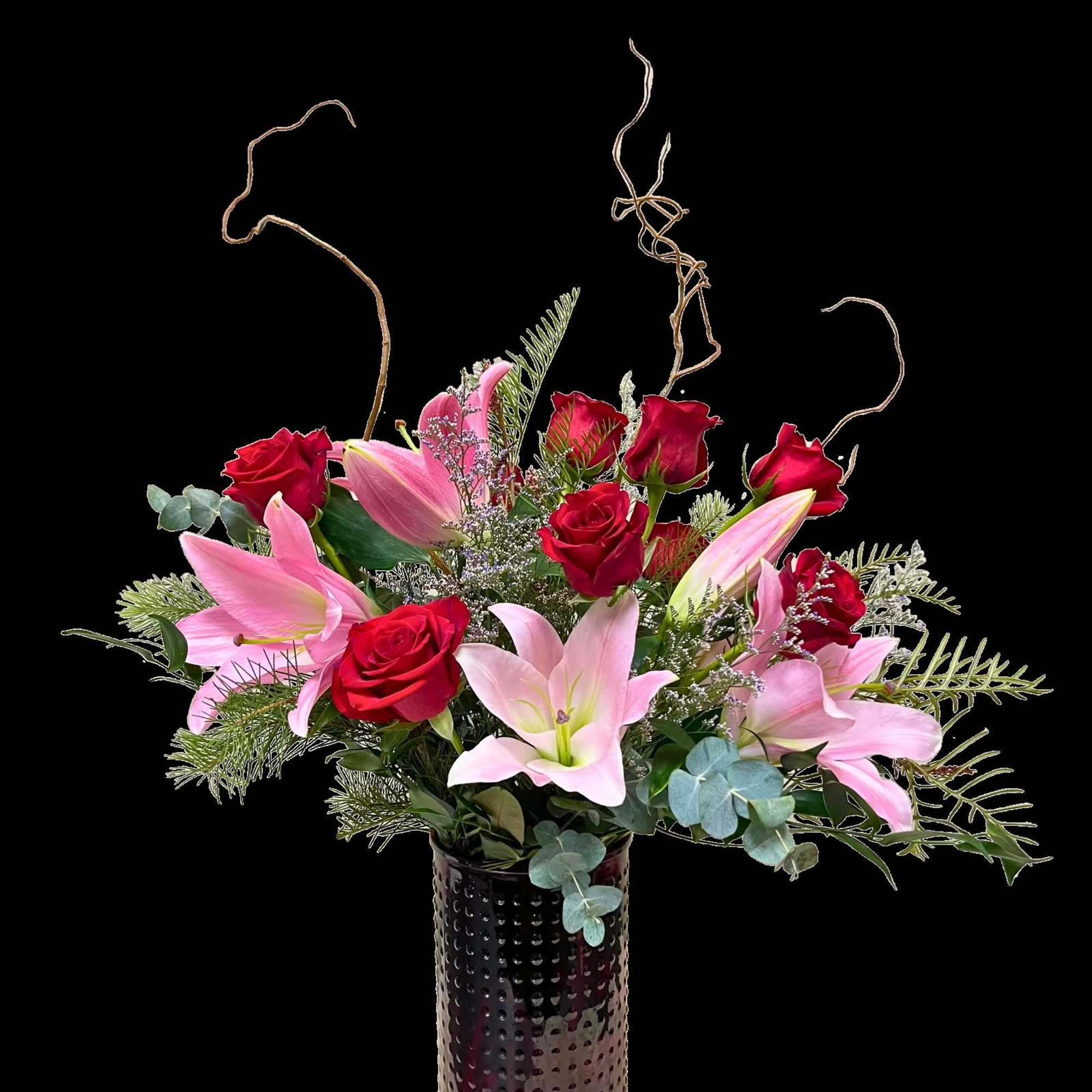 Pink lilies and red roses in a dark vase