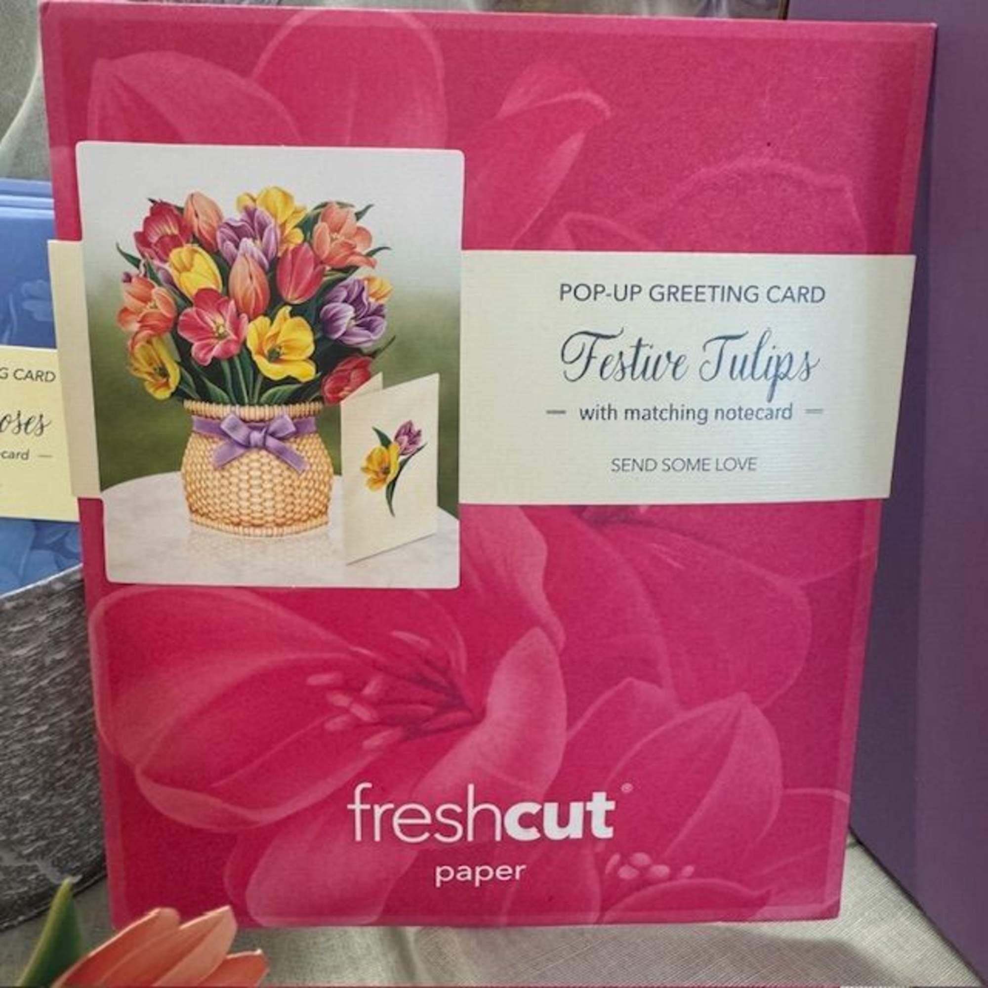 Pink pop-up greeting card box with a tulip bouquet illustration