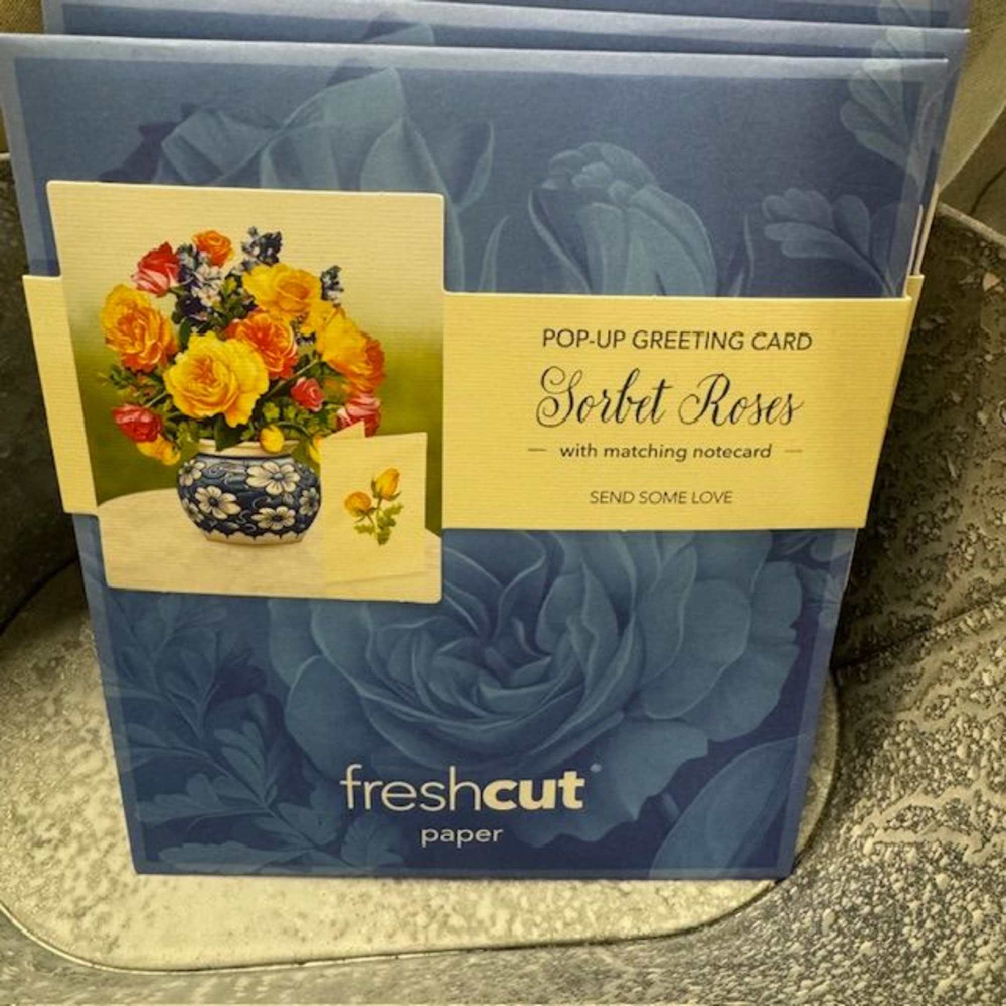 Pop-up greeting card with a bouquet of colorful roses in a vase