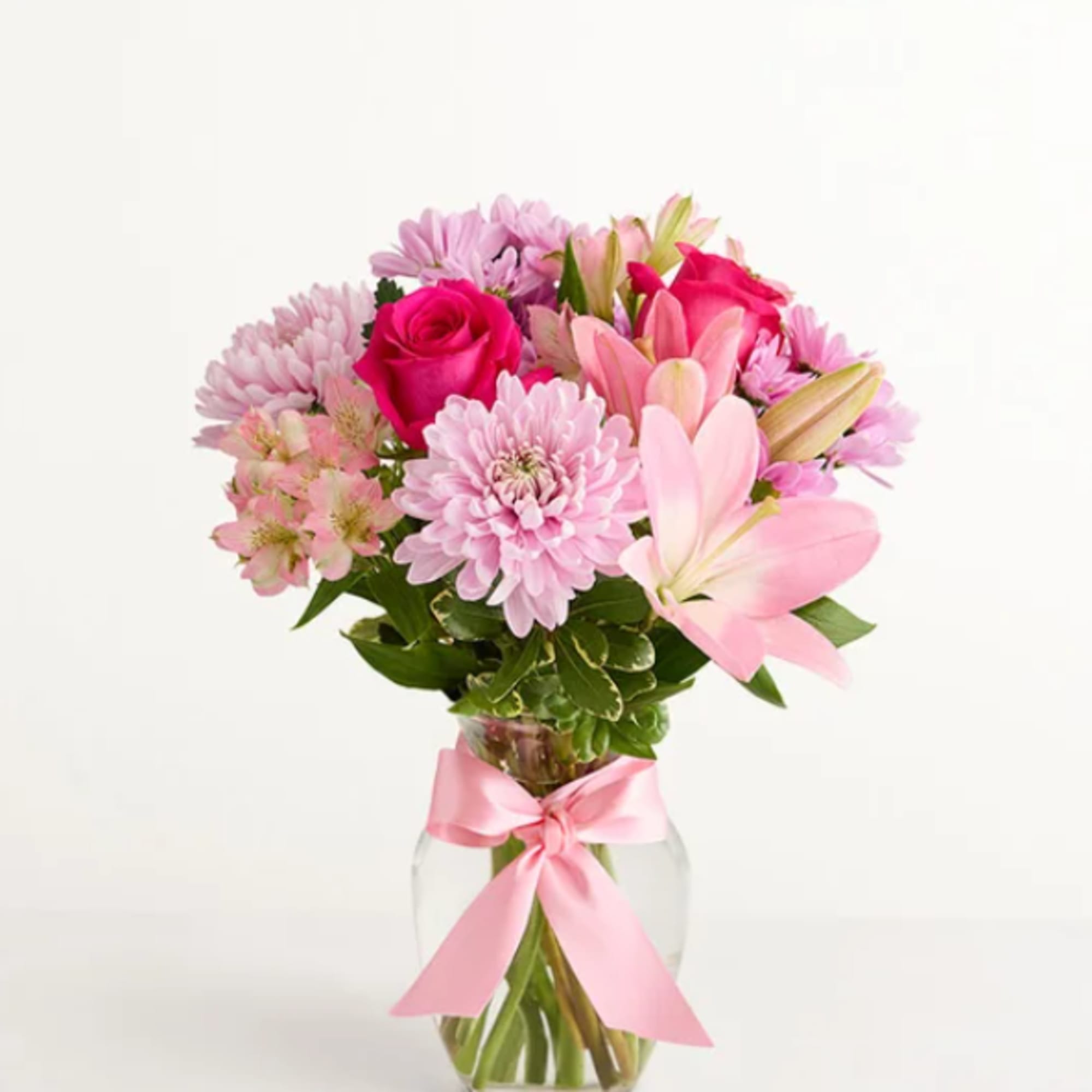 This floral arrangement celebrates the comfort of Mom's hugs with lovely pink