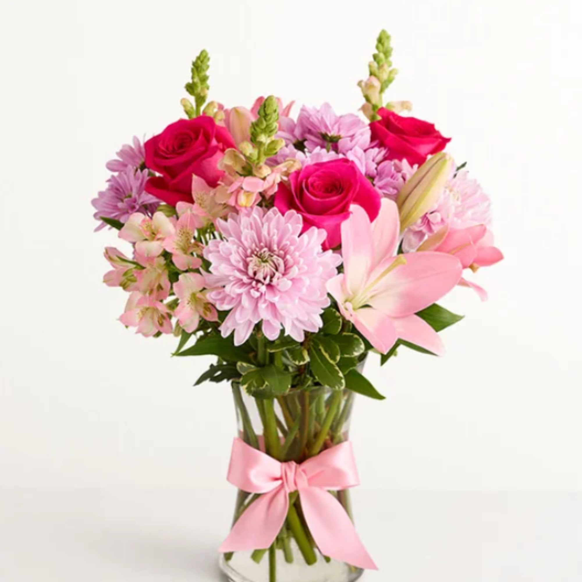 This floral arrangement celebrates the comfort of Mom's hugs with lovely pink