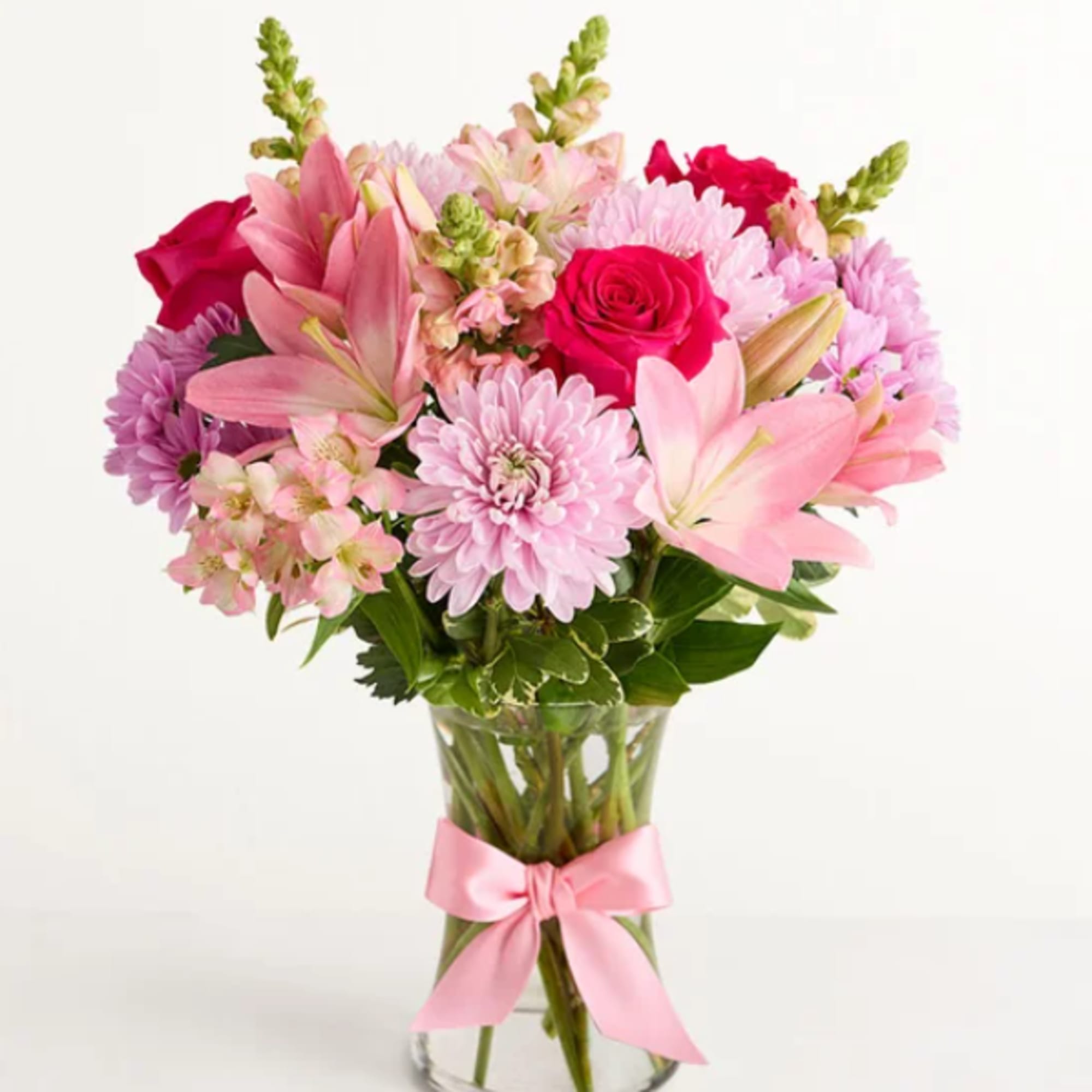 This floral arrangement celebrates the comfort of Mom's hugs with lovely pink