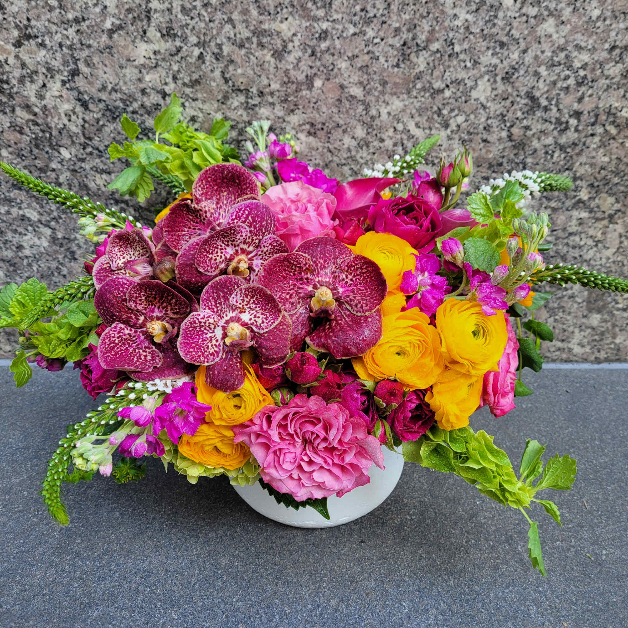 Immerse yourself in the brilliance of our Scarlet Sunset arrangement, where vibrant