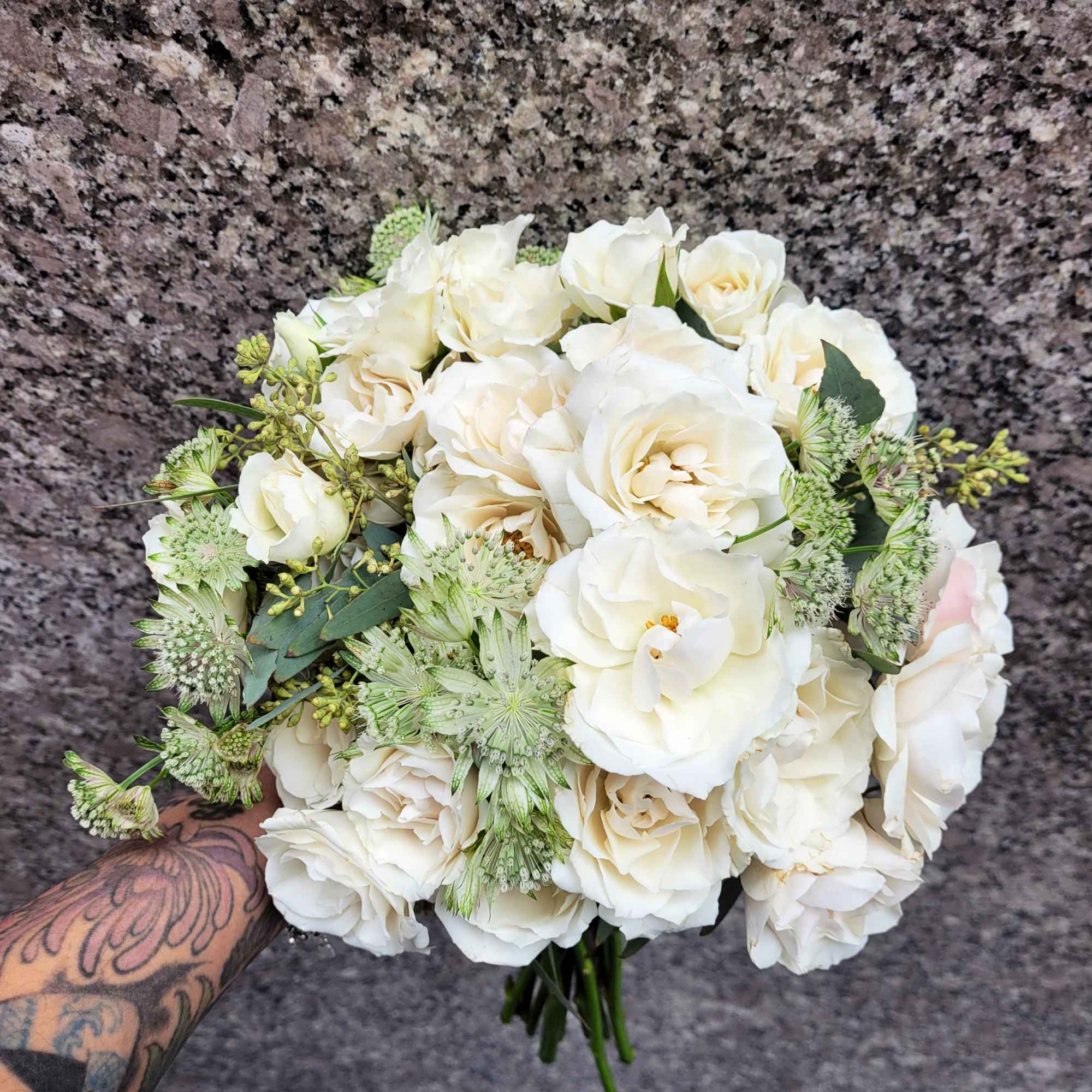 Delicate spray roses come together in a symphony of beauty and grace.