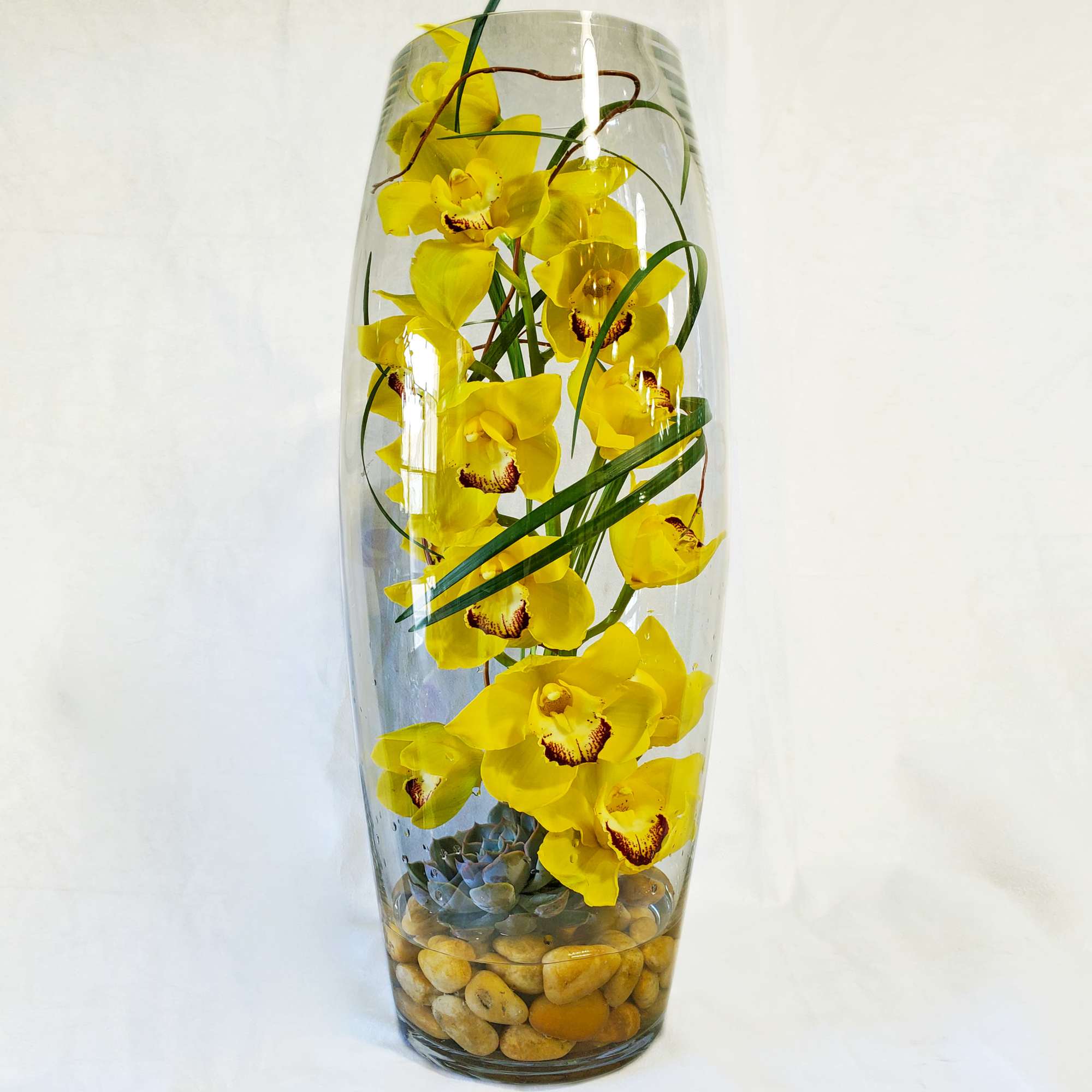 Make a modern statement with submerged green orchids! A simple glass cylinder