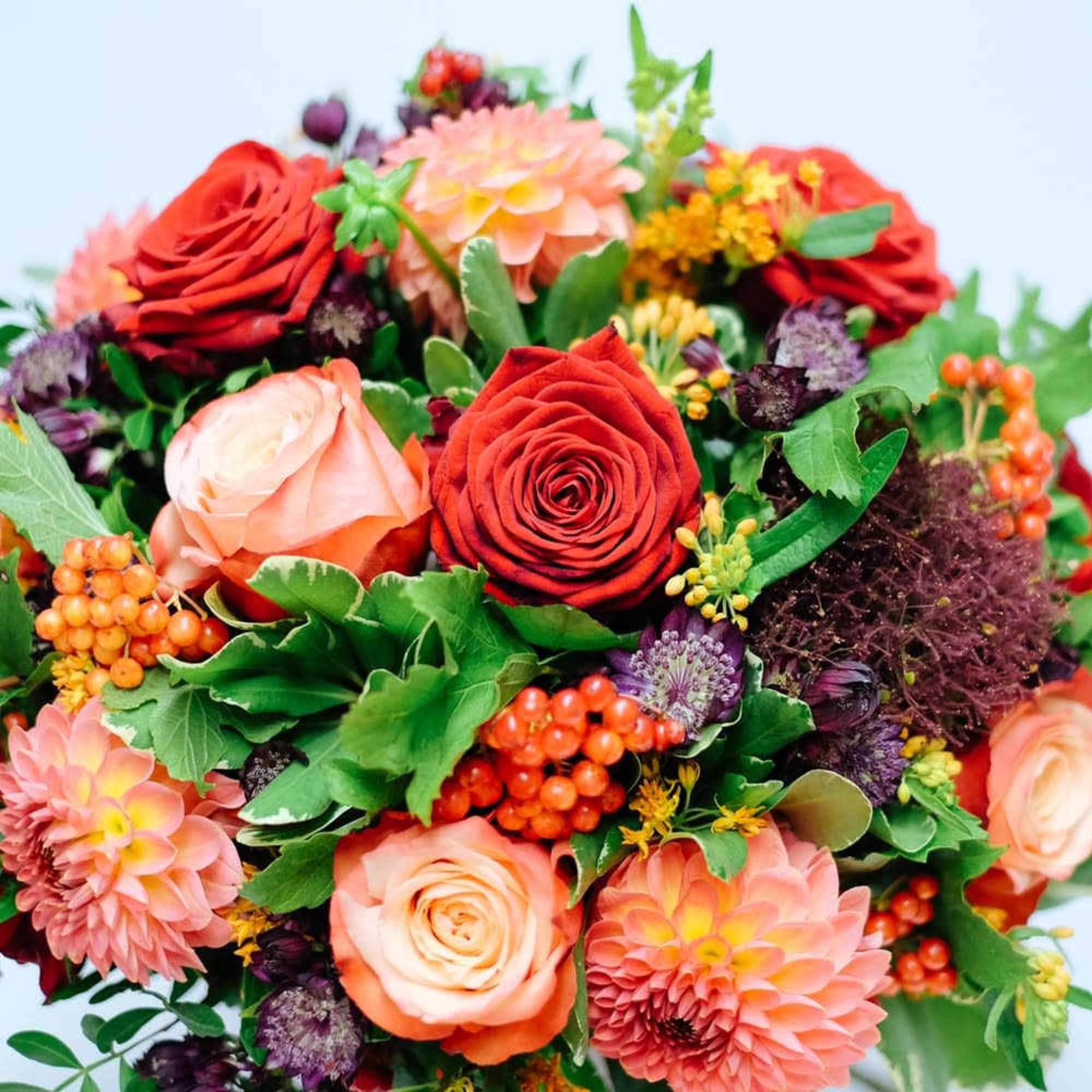 A delicious round bouquet of orange blooms of Roses, Dahlia and seasonal, photo 2 of 2