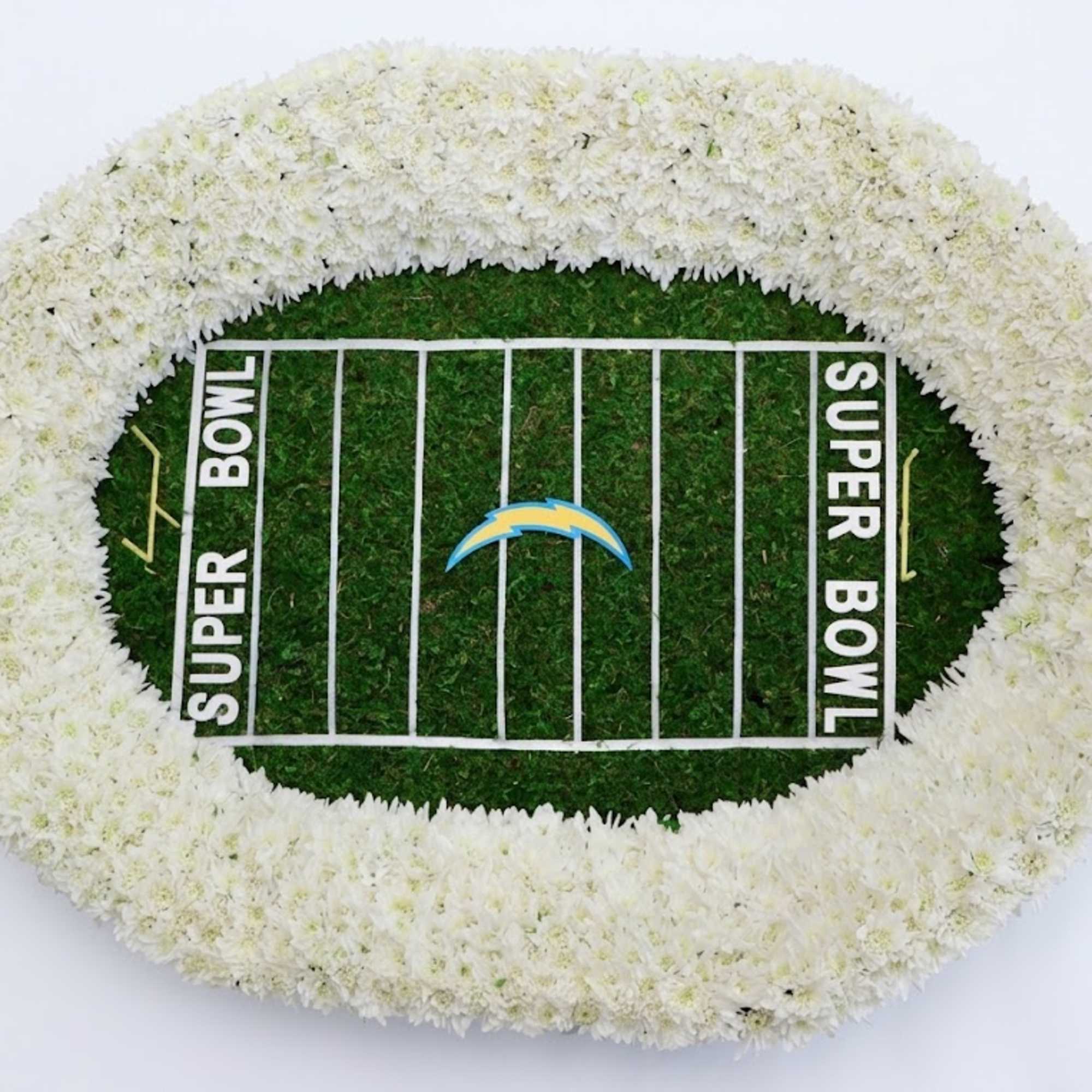 White floral football field arrangement with a Super Bowl design