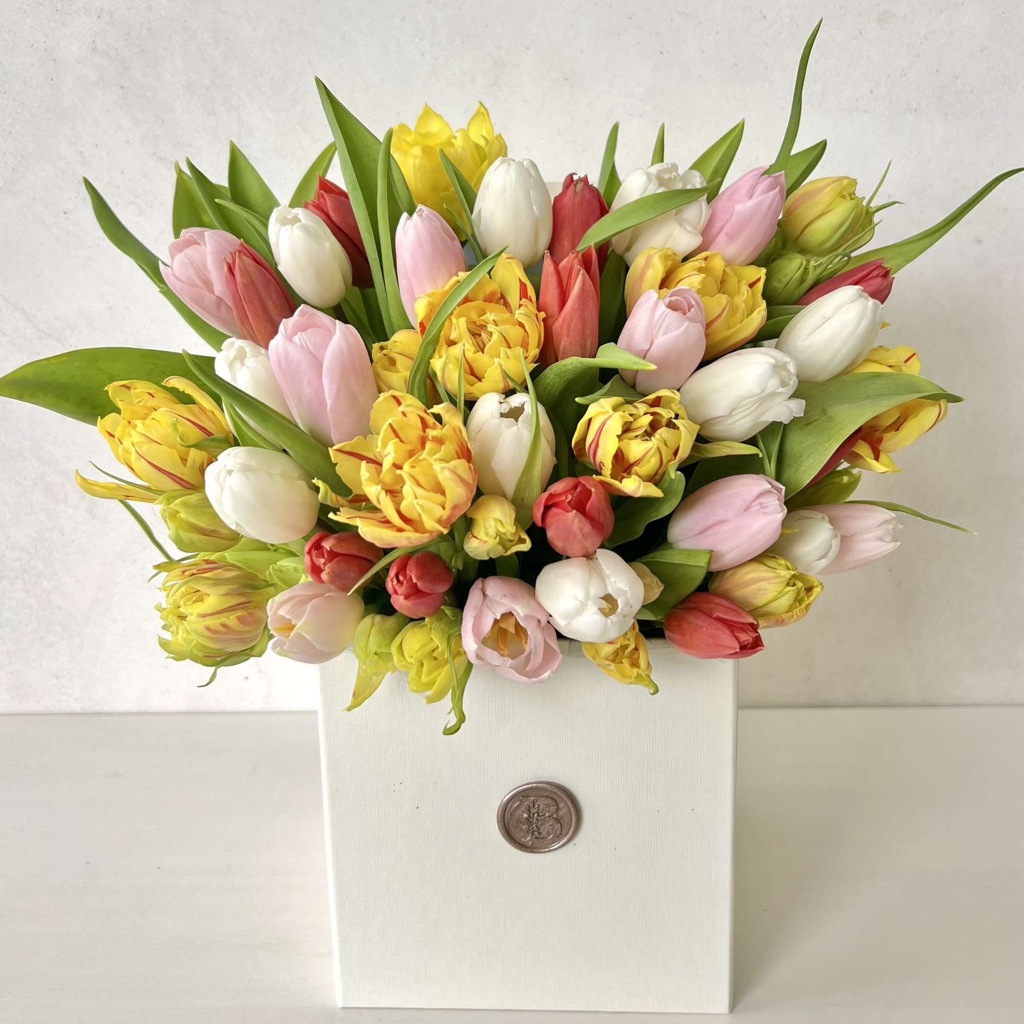 Mixed tulip bouquet in a white box