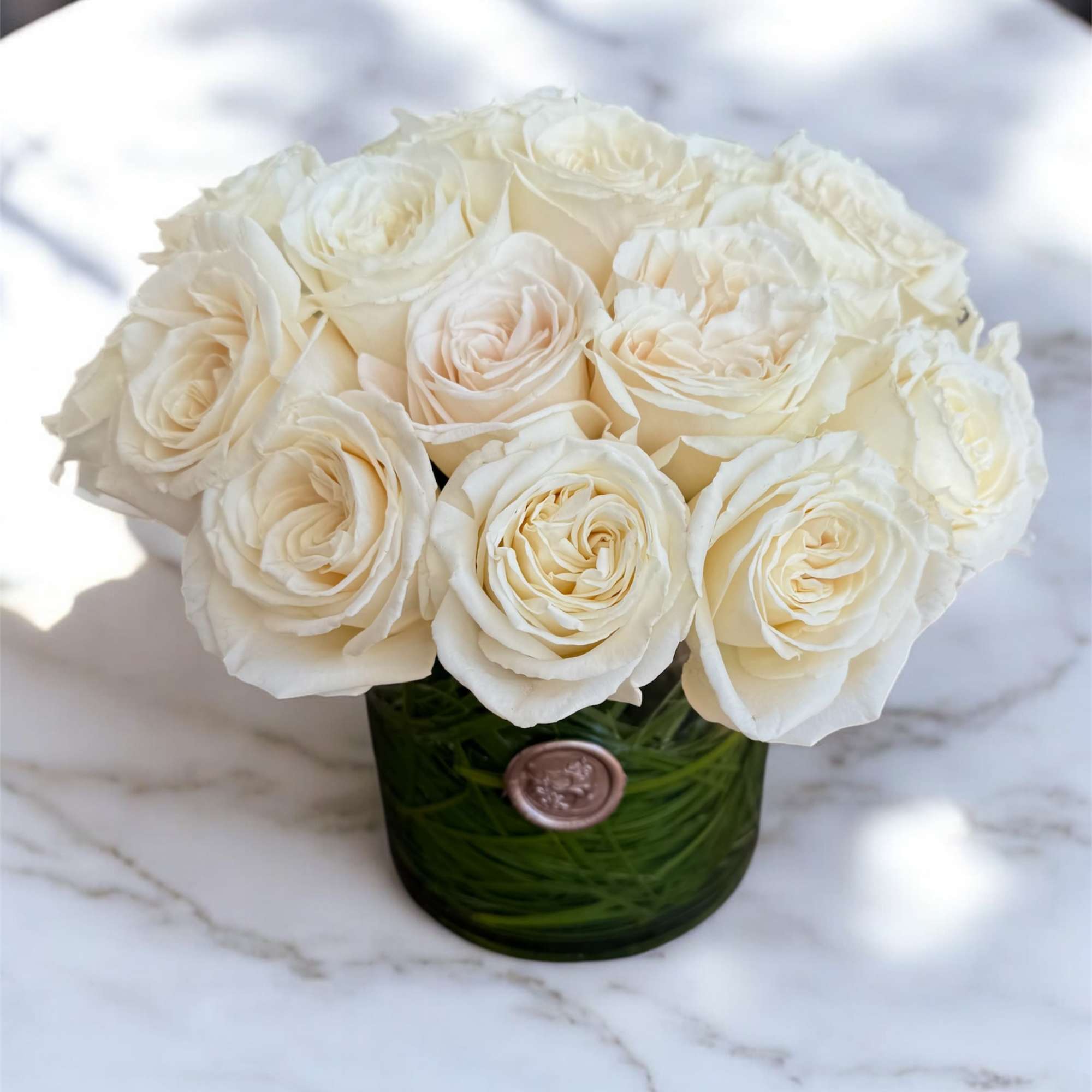 Twenty-four beautiful roses arranged in a clear glass vase. A classic and, photo 2 of 3