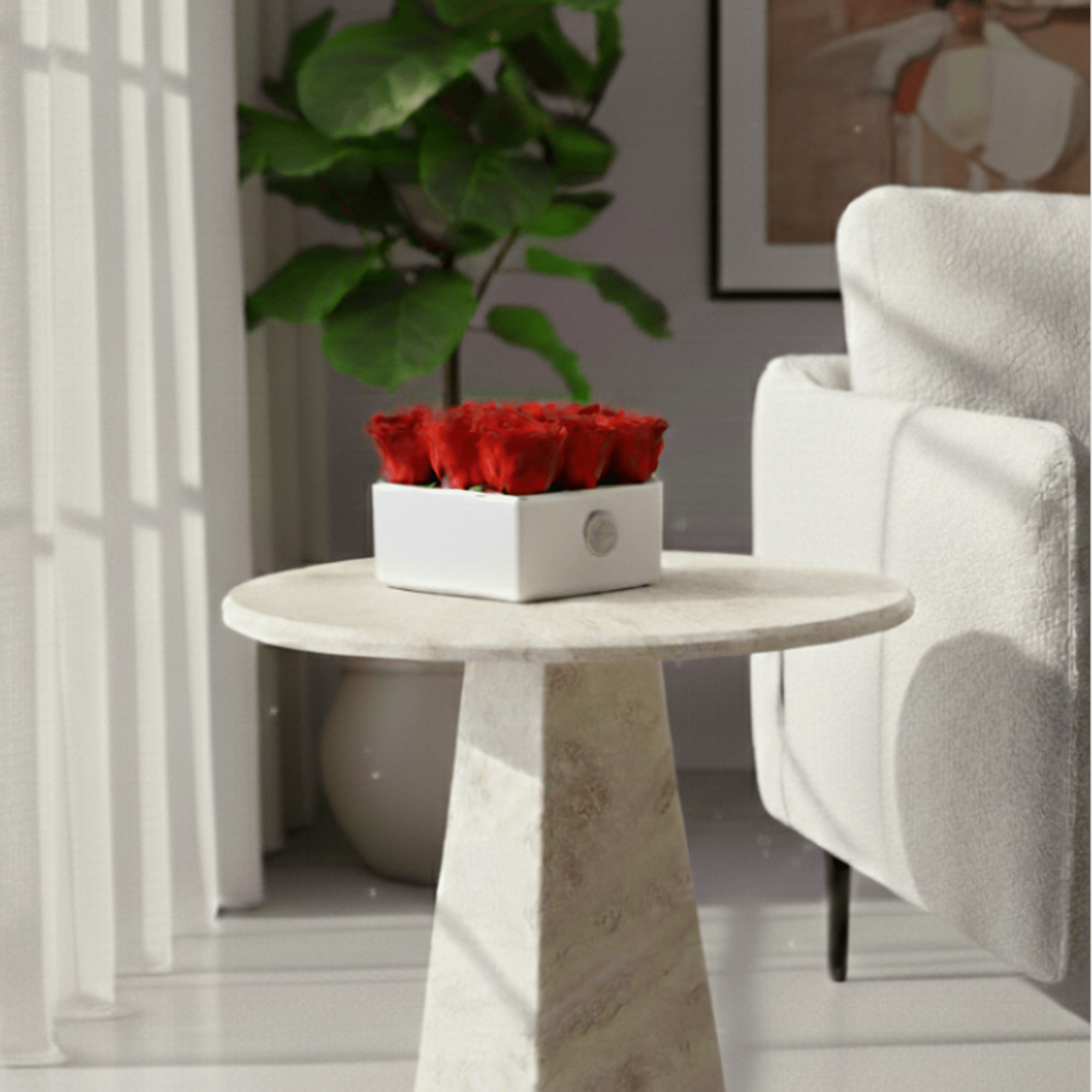 Red roses arranged in a white square box on a small table