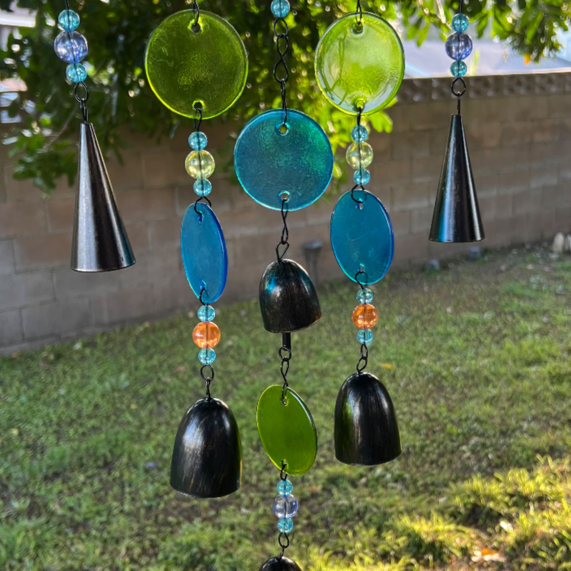 Colorful hanging glass and bead wind chime with black cone accents