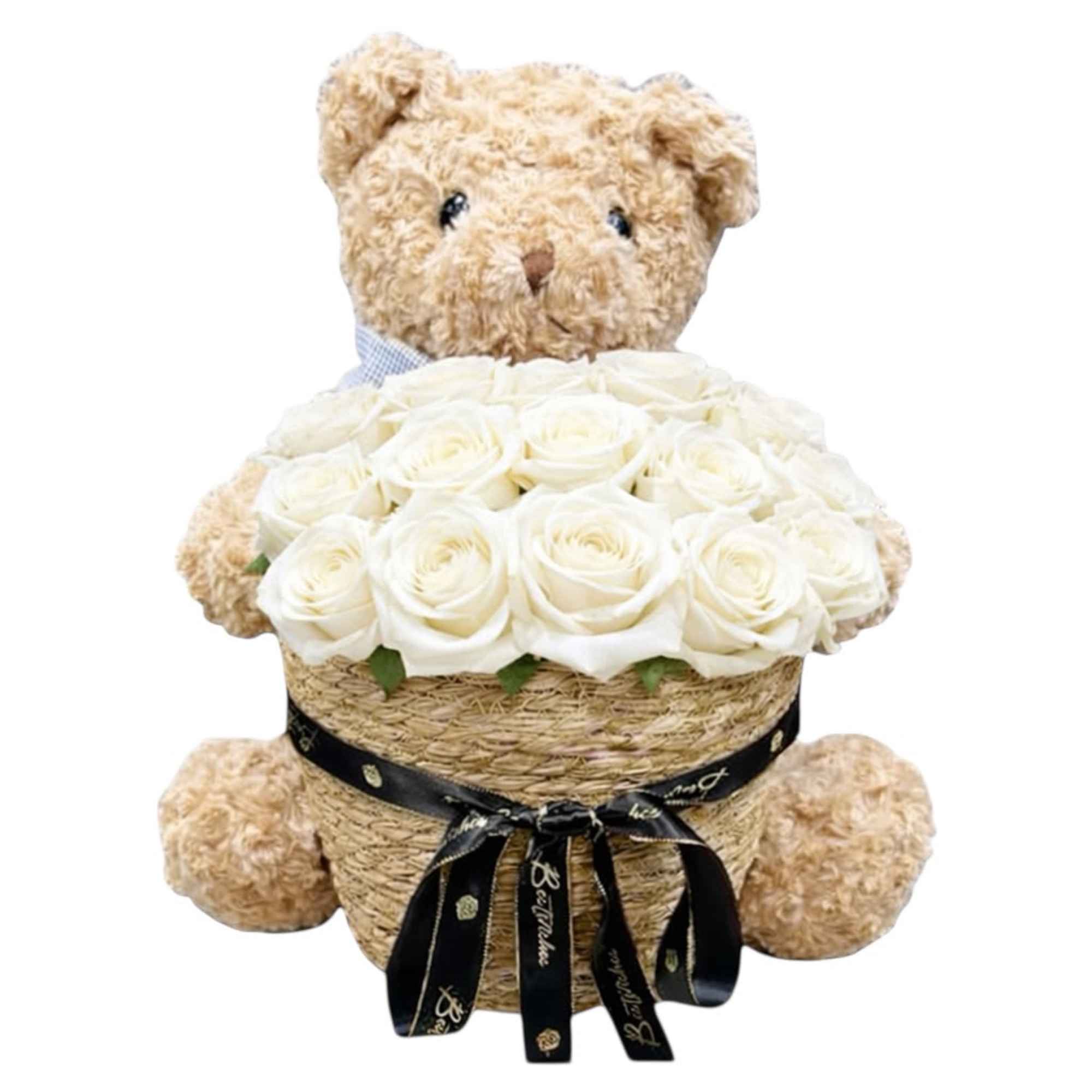 Teddy bear holding a basket of white roses