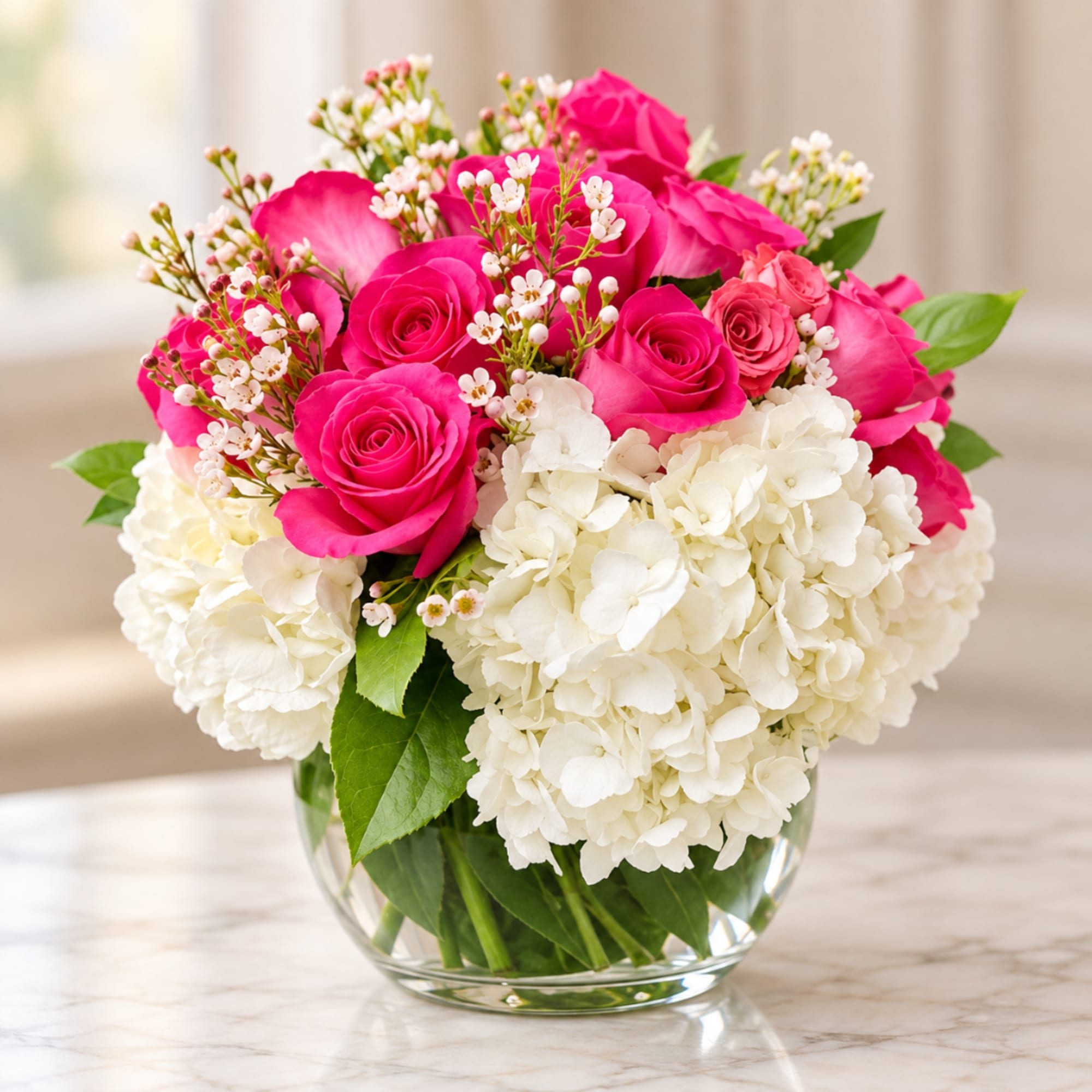 Pink roses and white hydrangeas in a clear glass vase, photo 4 of 4