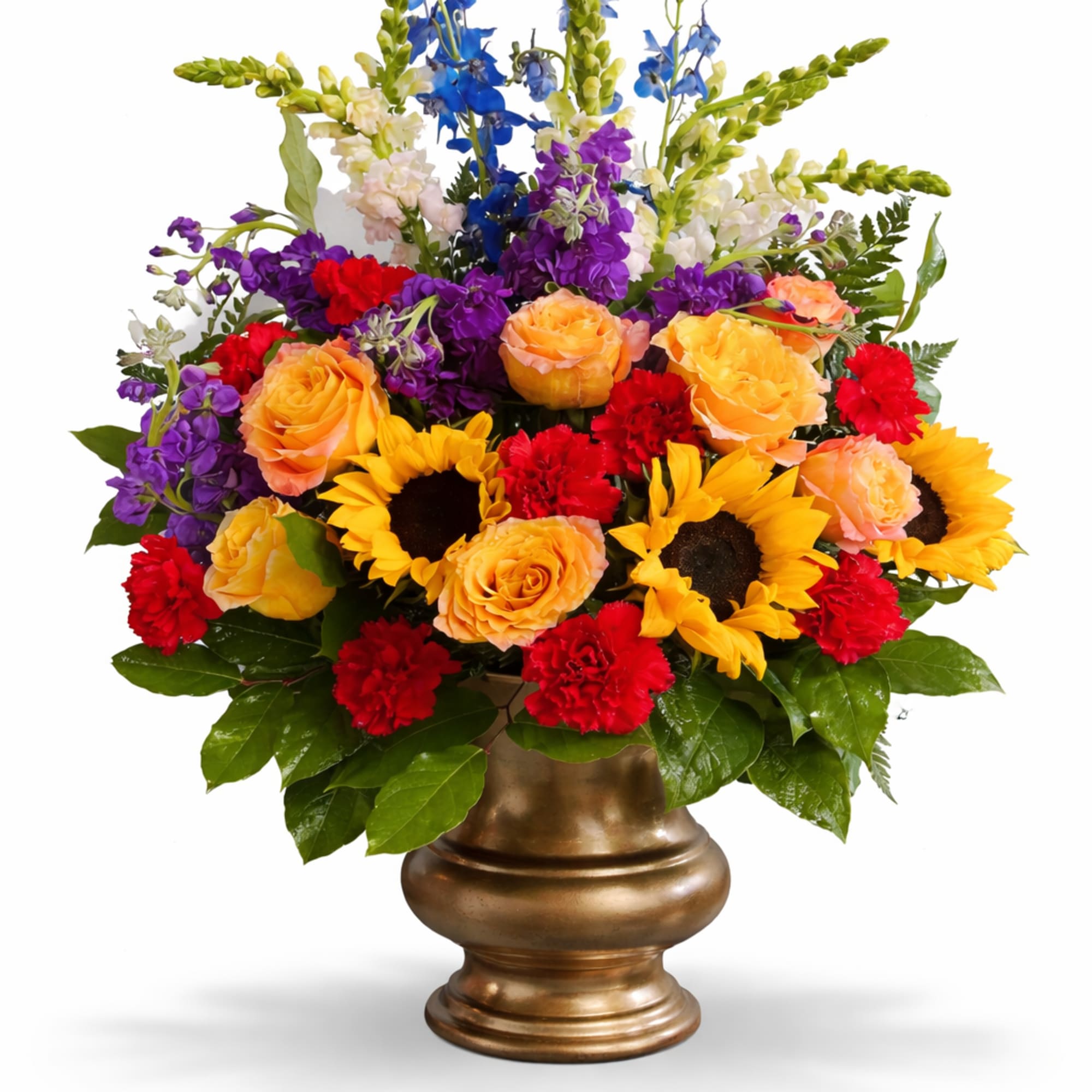 Colorful mixed flower arrangement in a gold vase