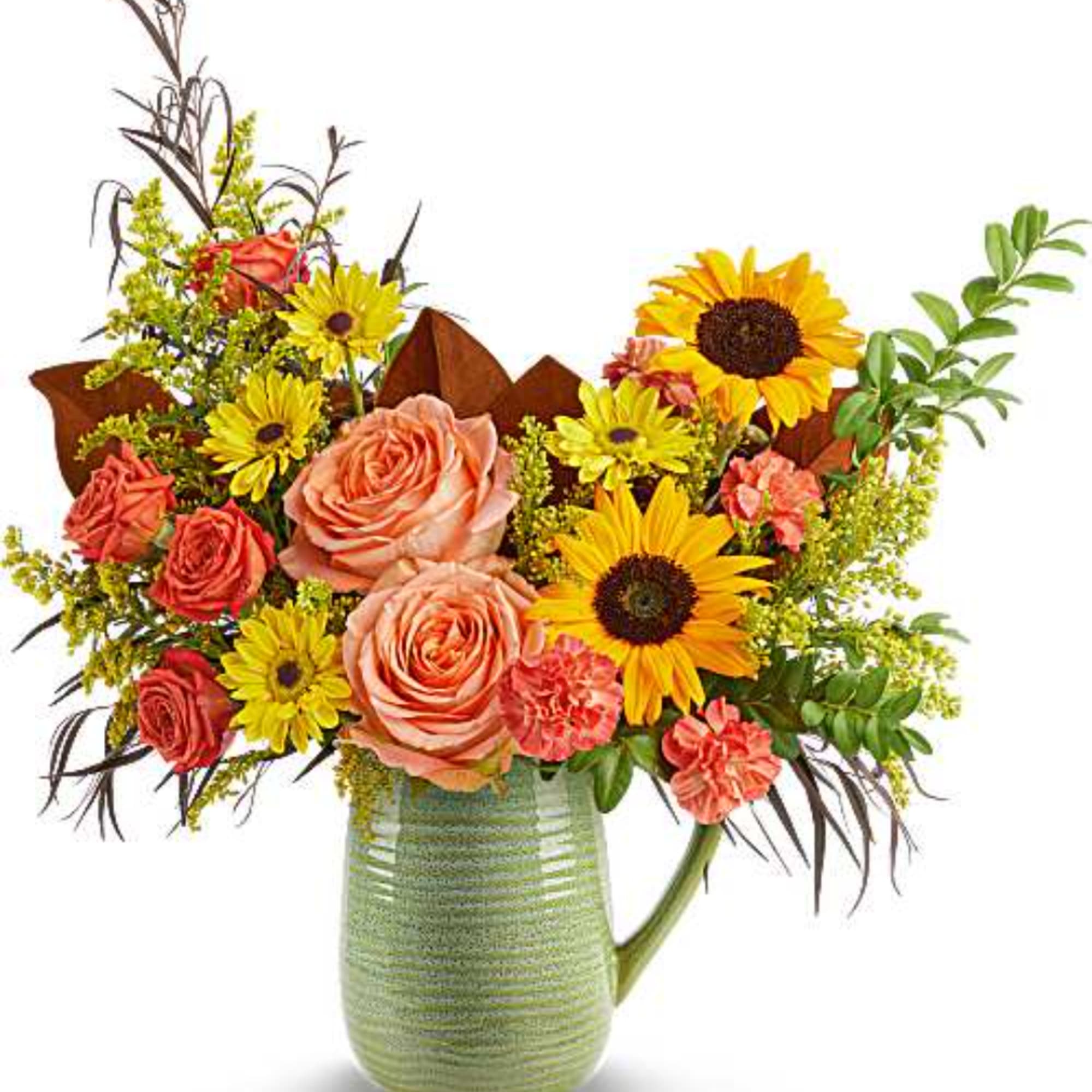 Mixed bouquet of roses, sunflowers, and daisies in a green pitcher vase