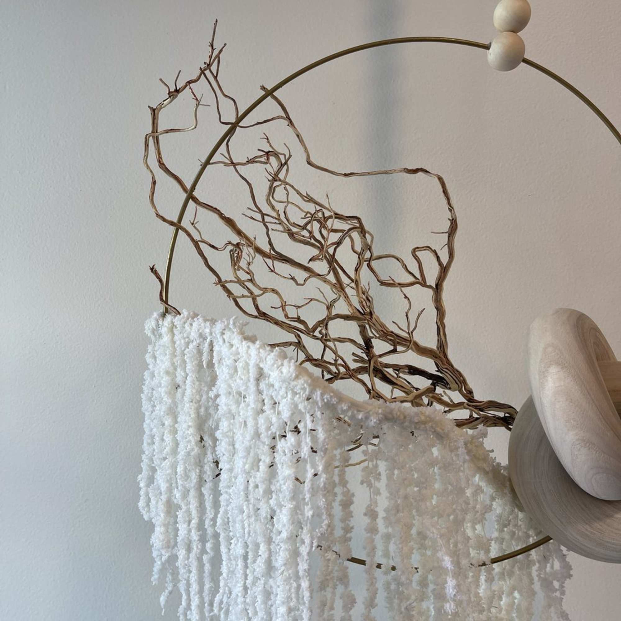Minimal hanging floral hoop with white cascading blooms and dried branches, photo 4 of 4