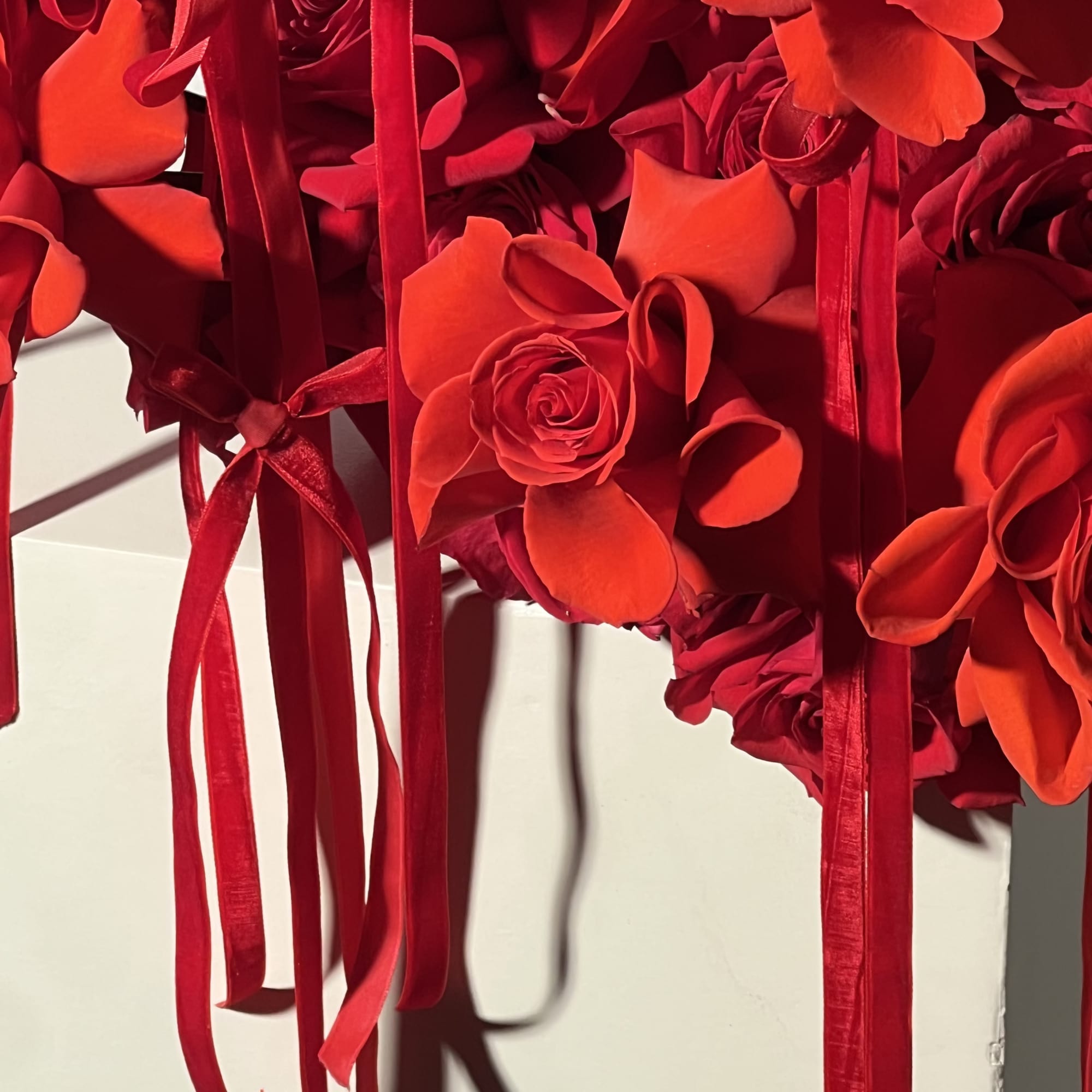 Red rose bouquet with long ribbon streamers