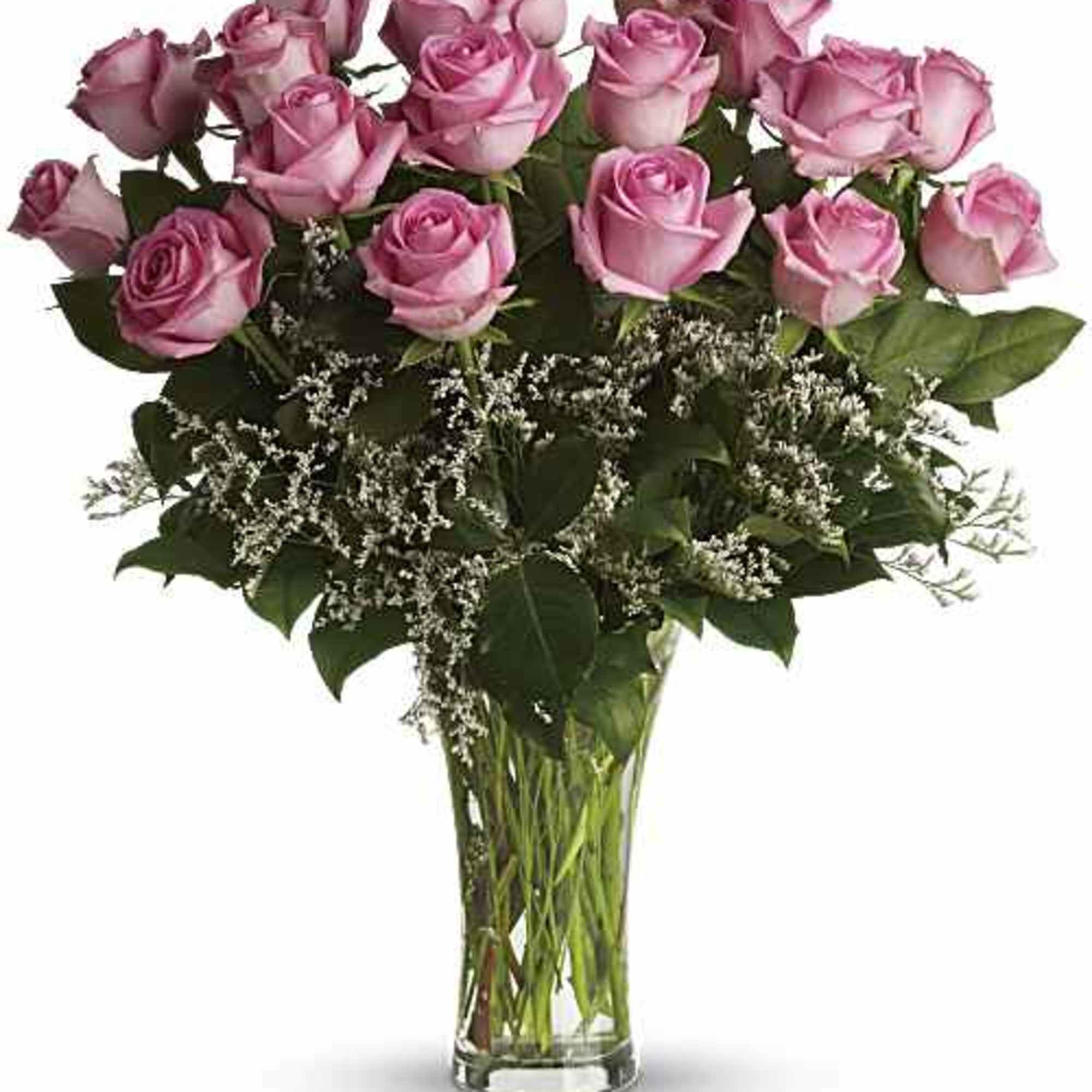 Pink roses arranged in a clear glass vase