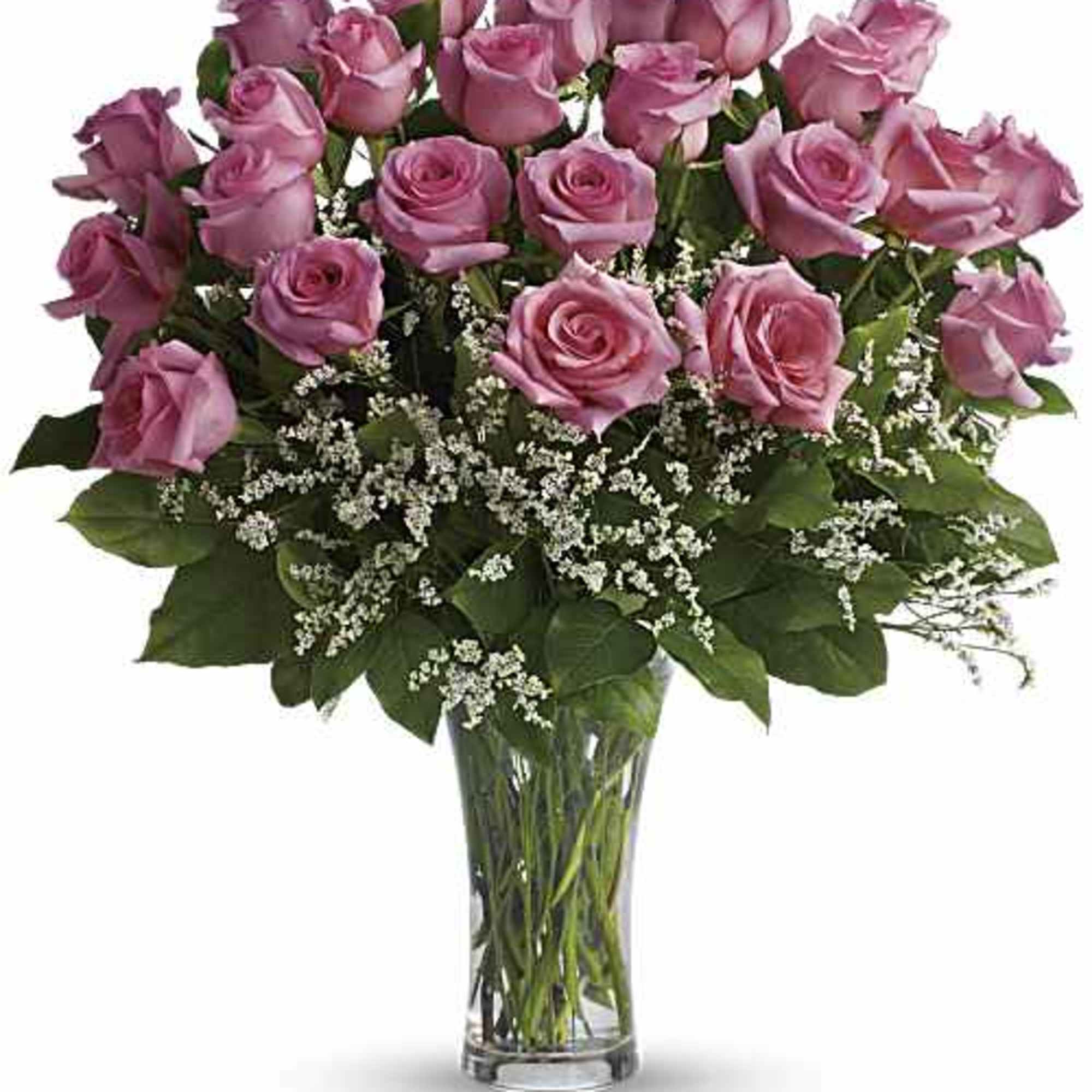 Pink roses arranged in a clear glass vase